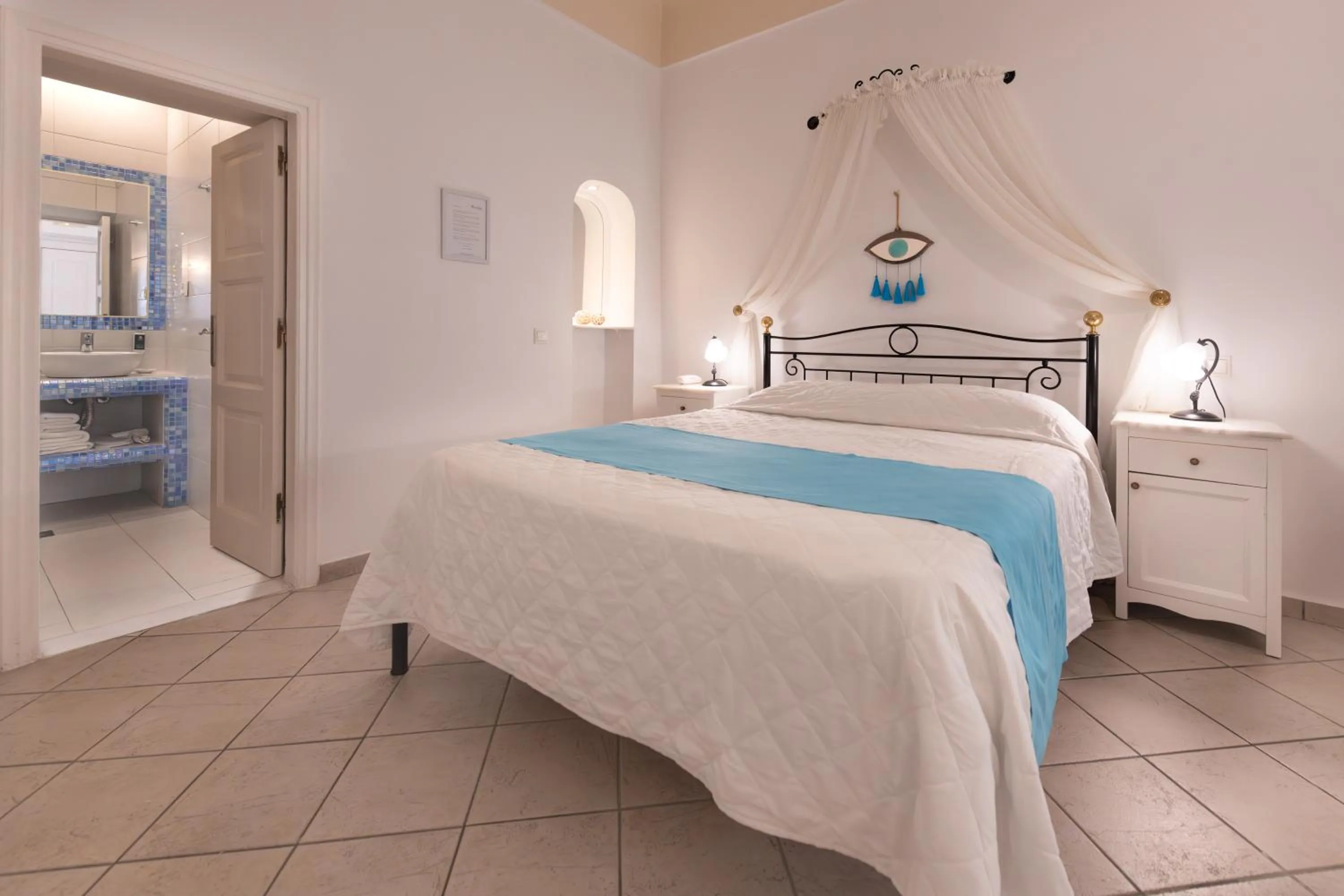 Bed in Reverie Santorini Hotel