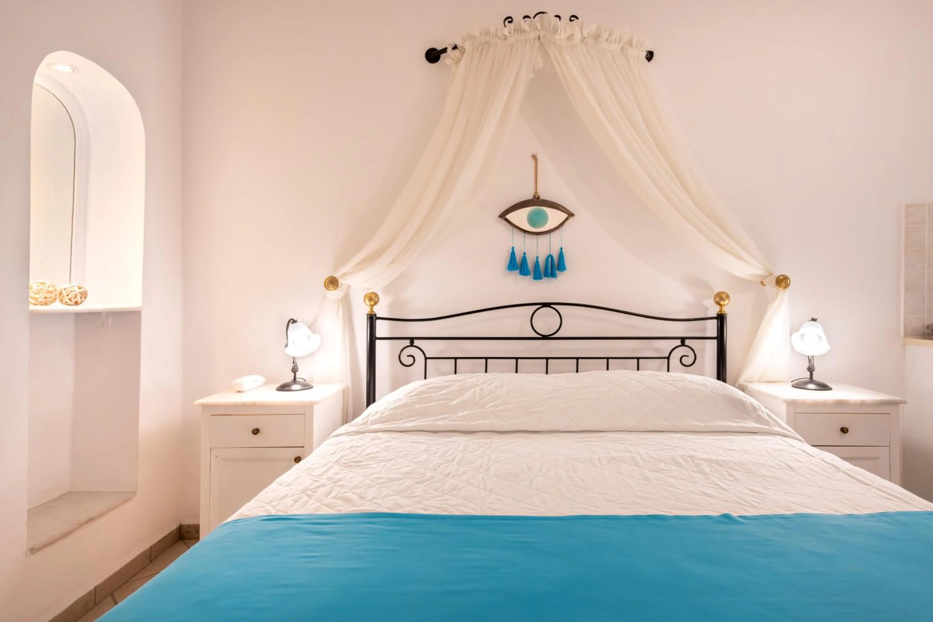 Bed in Reverie Santorini Hotel