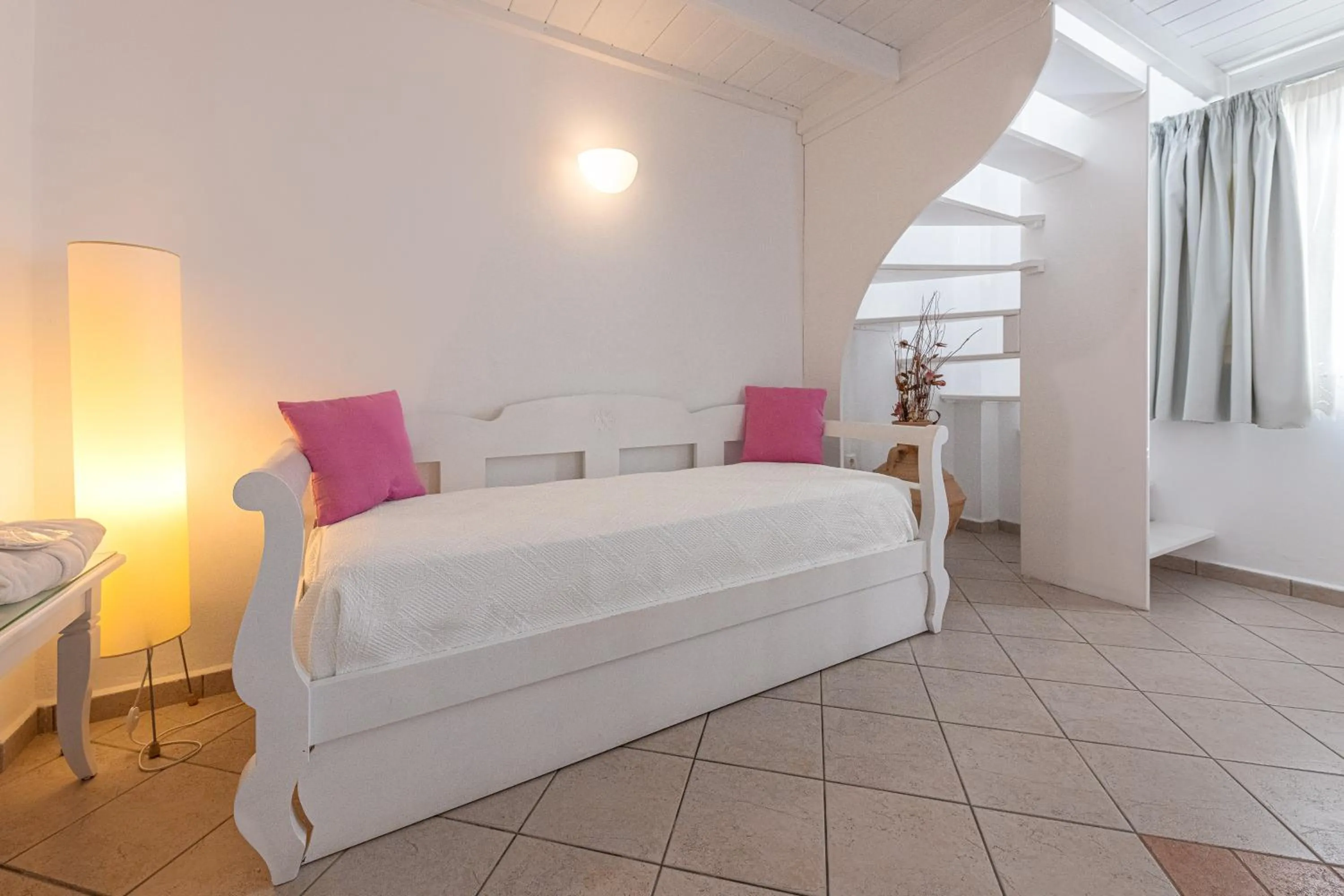 Bed in Reverie Santorini Hotel