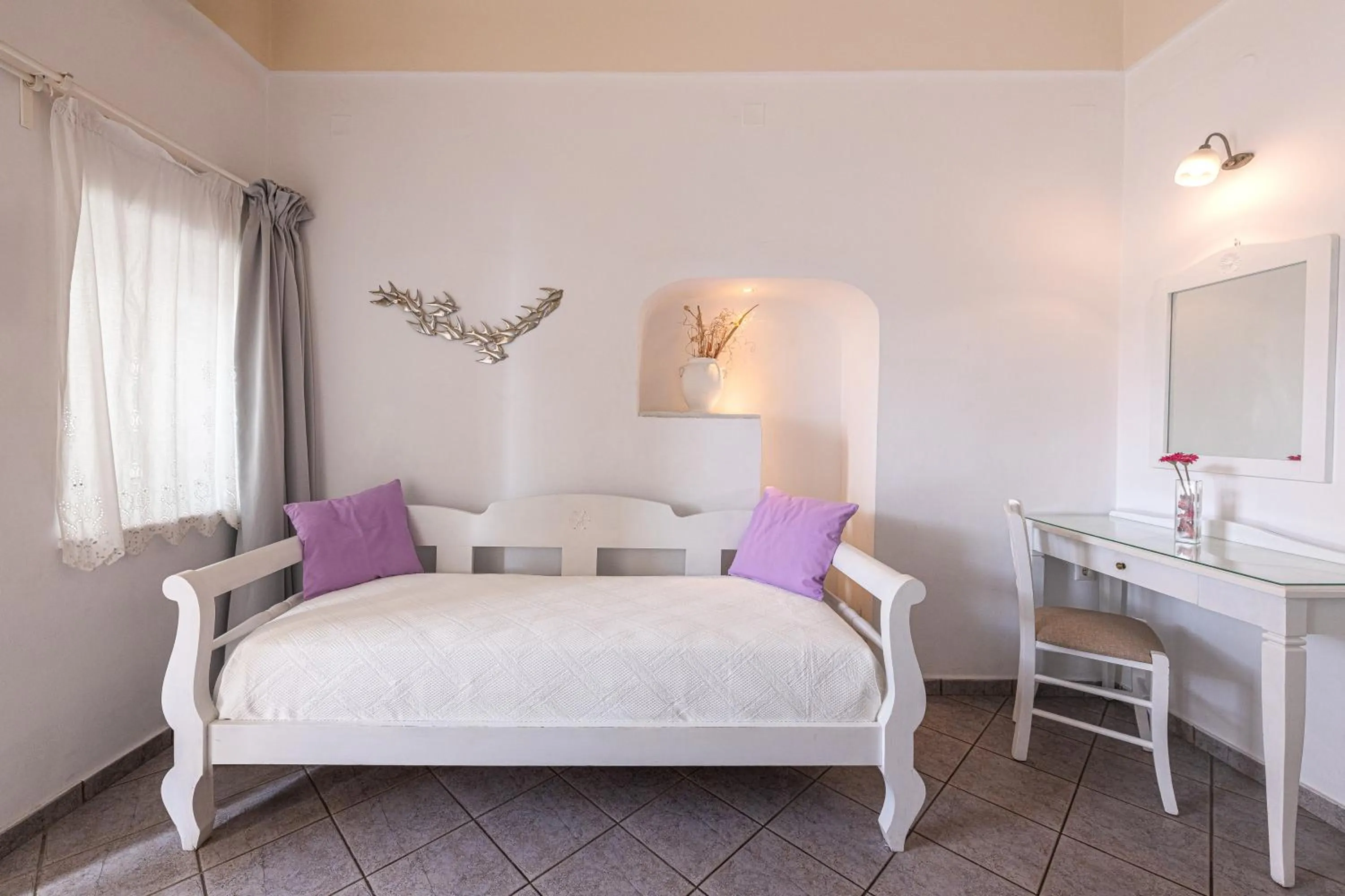 Bed in Reverie Santorini Hotel