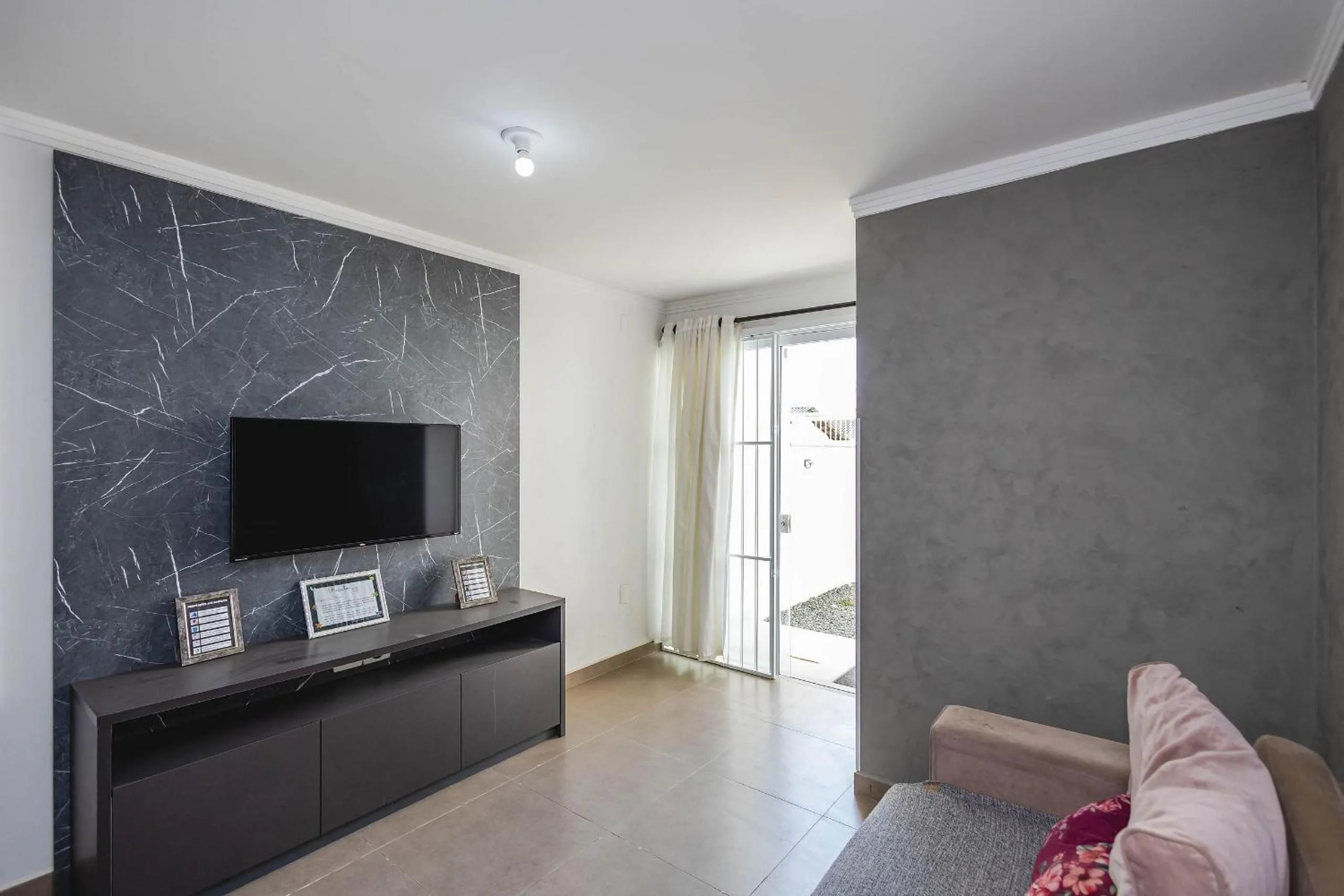 Living room in Completa casa apenas 700m da praia