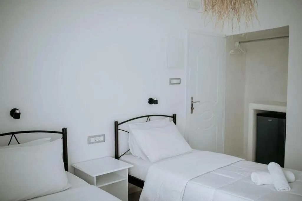 Bed in Hotel Thirasia