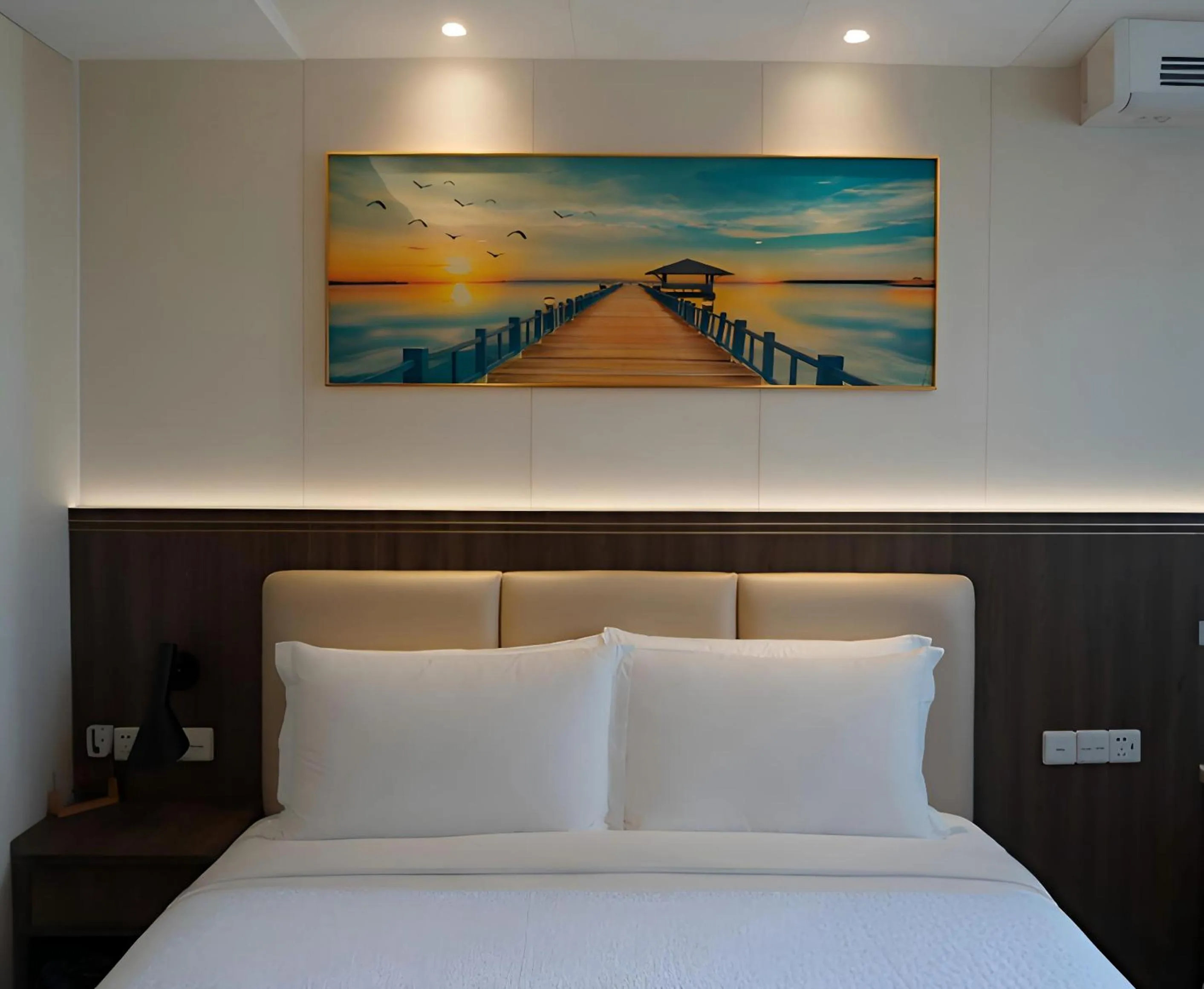 Bed in Escale International Hotel