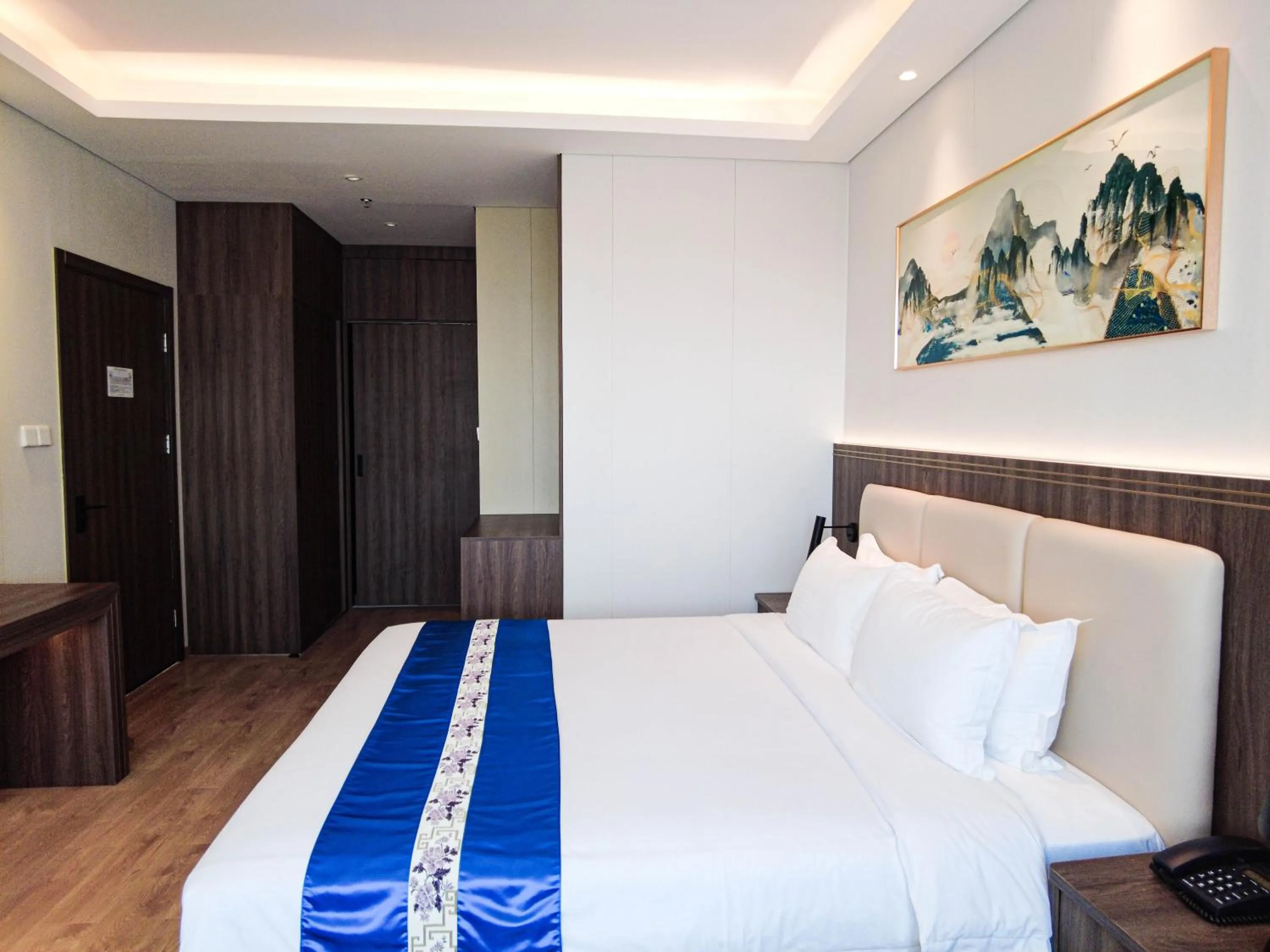 Bed in Escale International Hotel