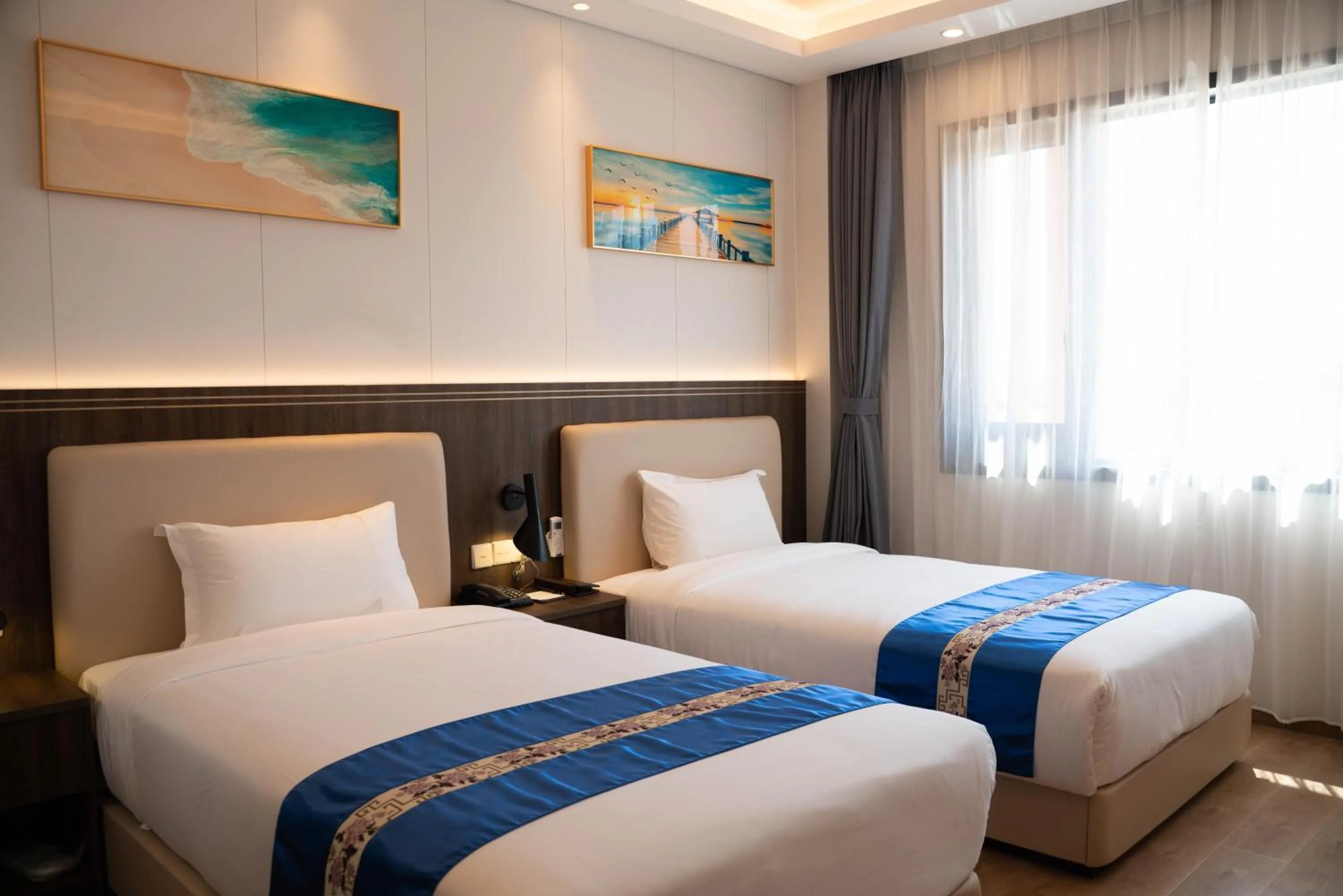 Bed in Escale International Hotel