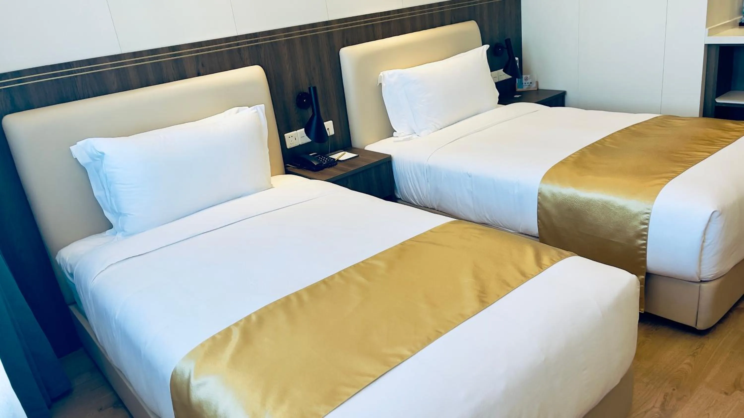 Bed in Escale International Hotel