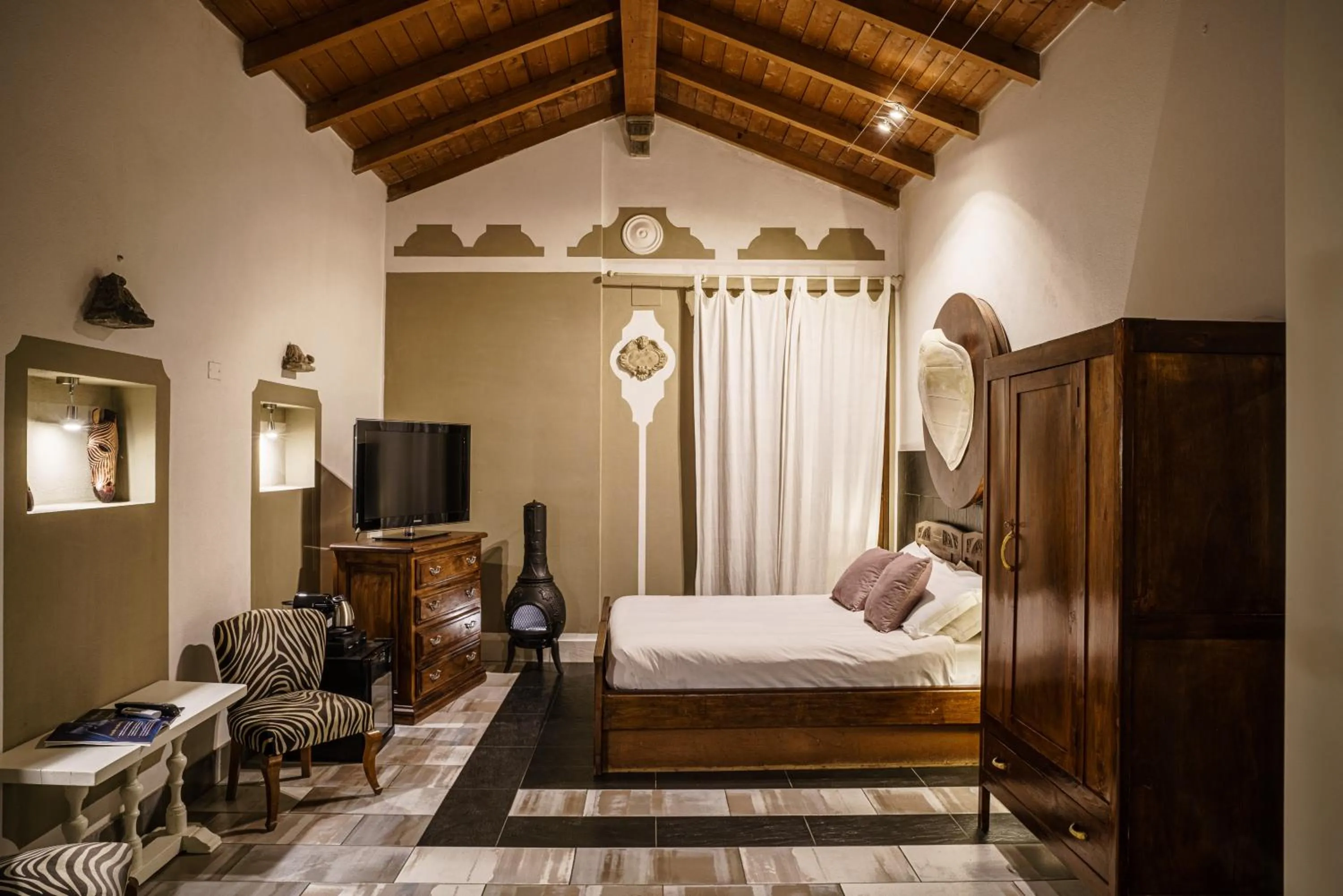 Photo of the whole room, Bed in Le Meraviglie di Alice