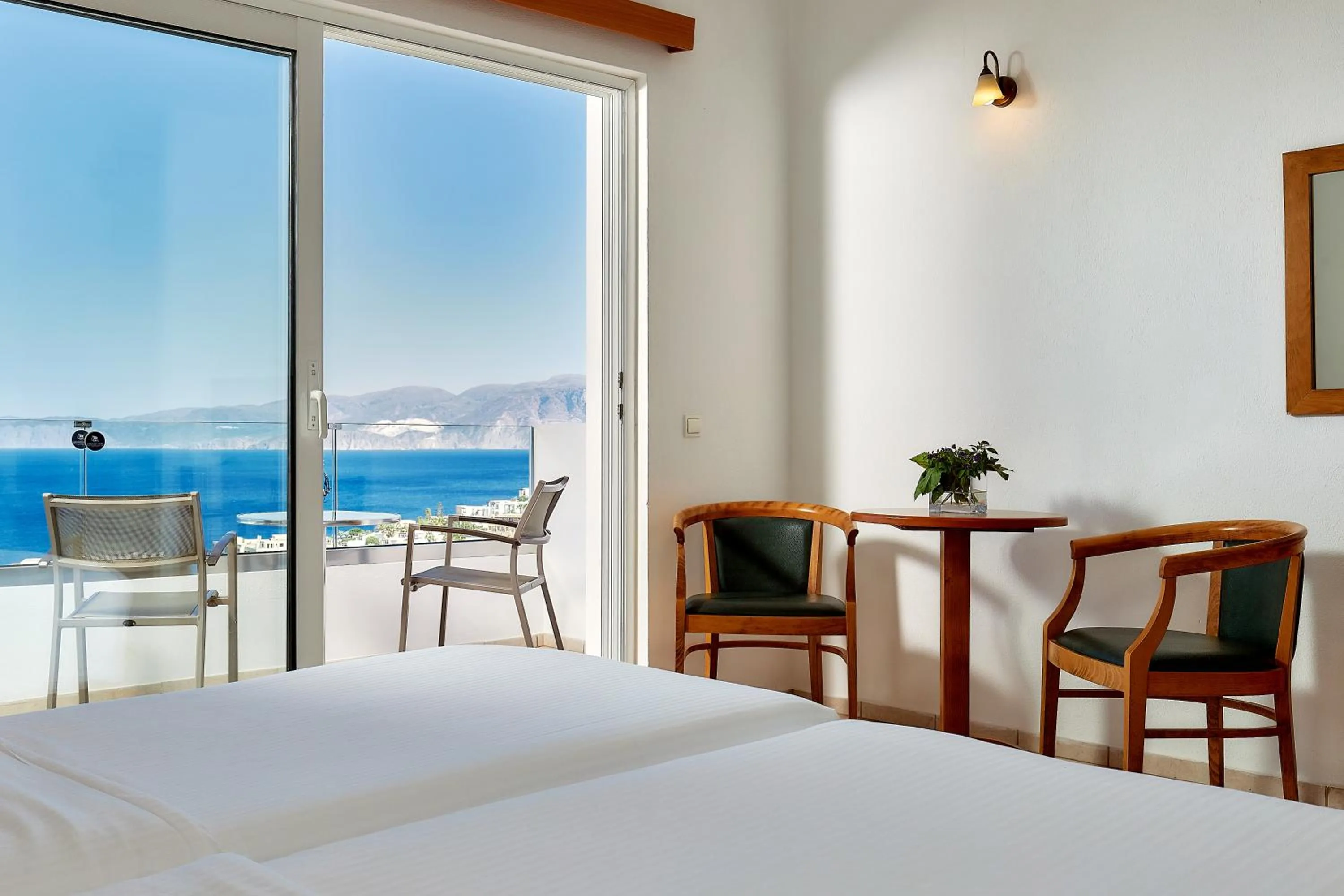 Seating area, Bed in Elounda Ilion Hotel Bungalows