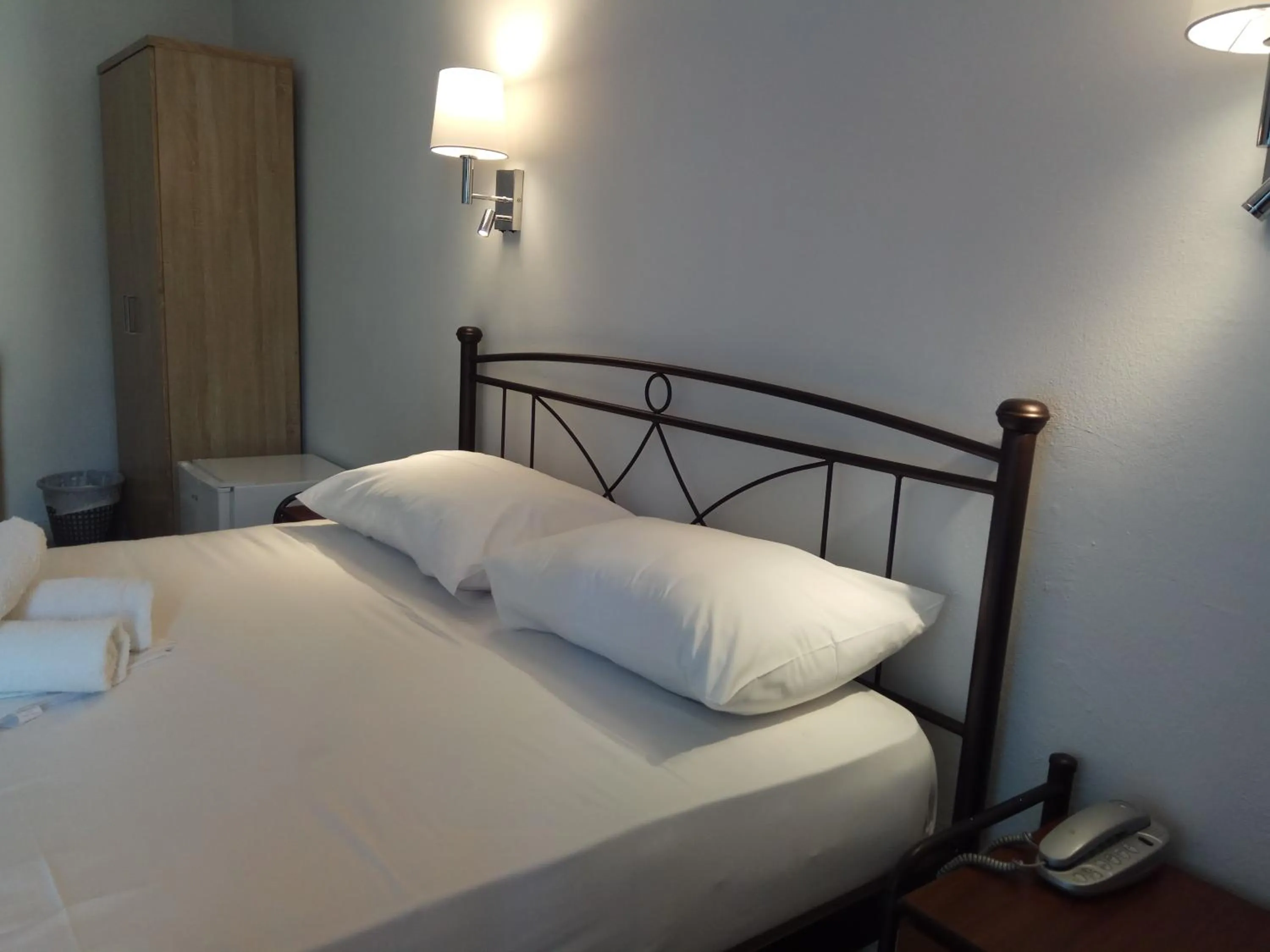 Bed in Delfini Hotel