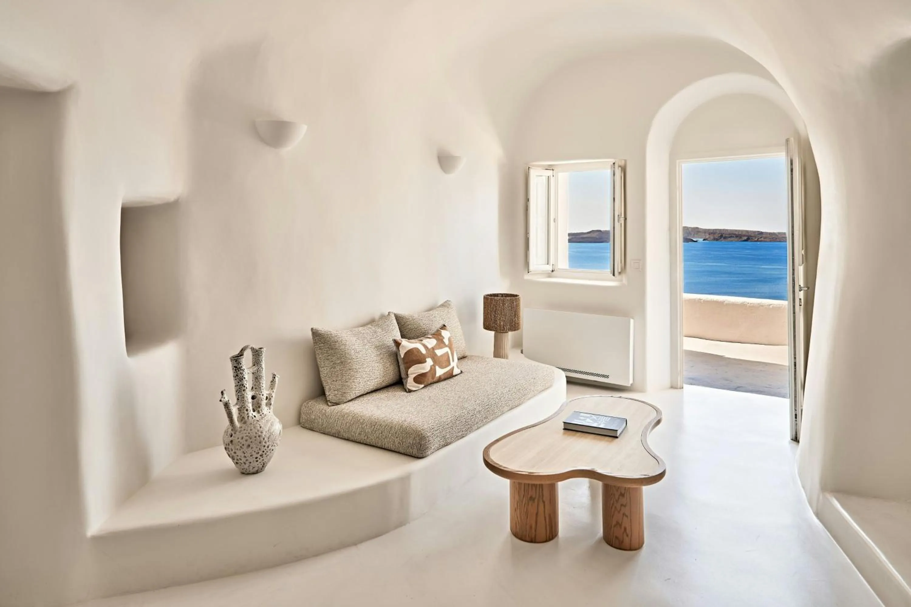 Photo of the whole room in Mystique, a Luxury Collection Hotel, Santorini