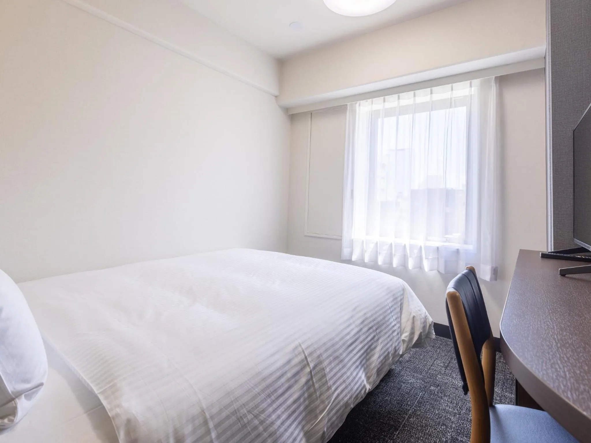 Photo of the whole room, Bed in KOKO HOTEL Shizuoka - formerly Hotel Wing International Shizuoka