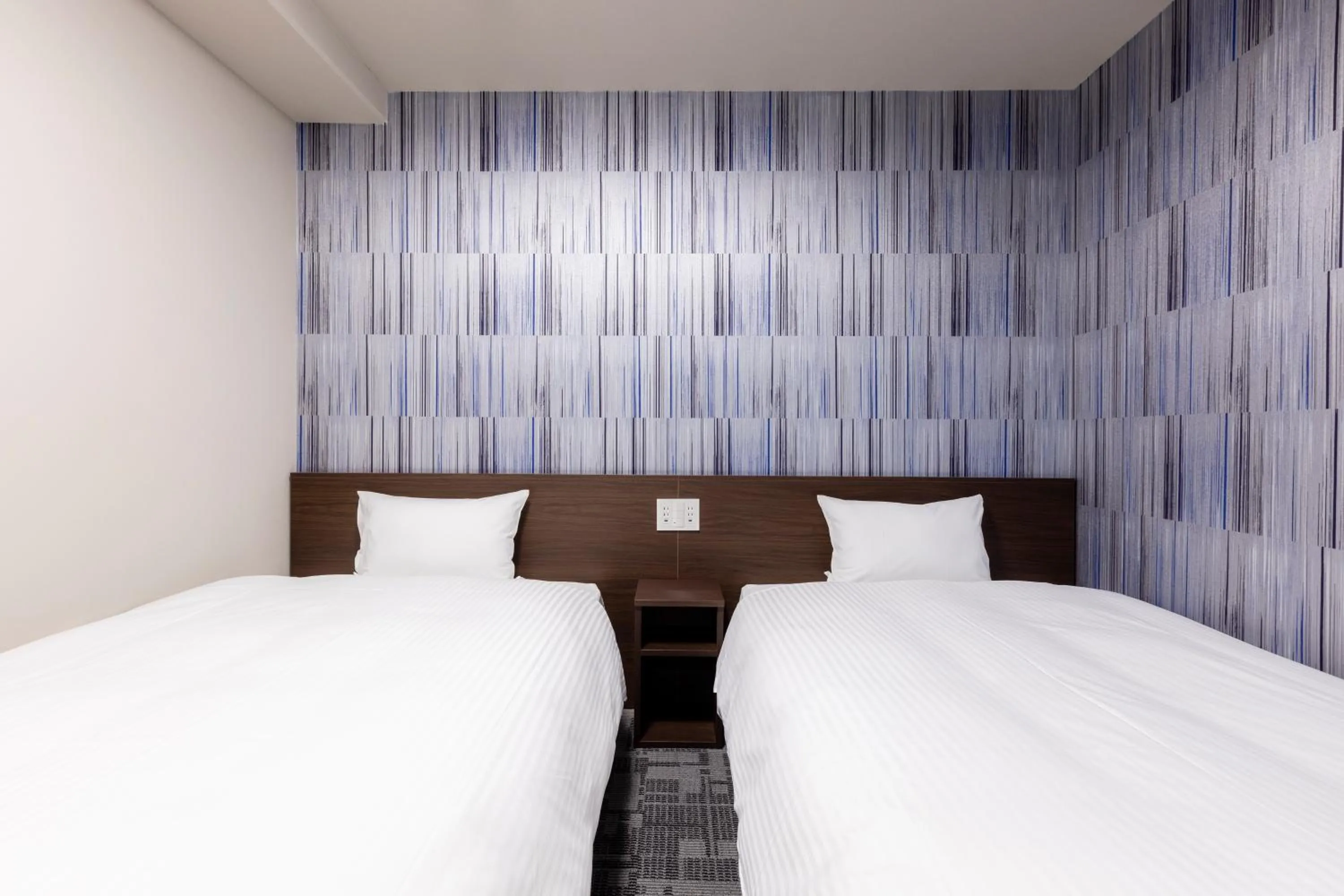 Bed in KOKO HOTEL Shizuoka - formerly Hotel Wing International Shizuoka