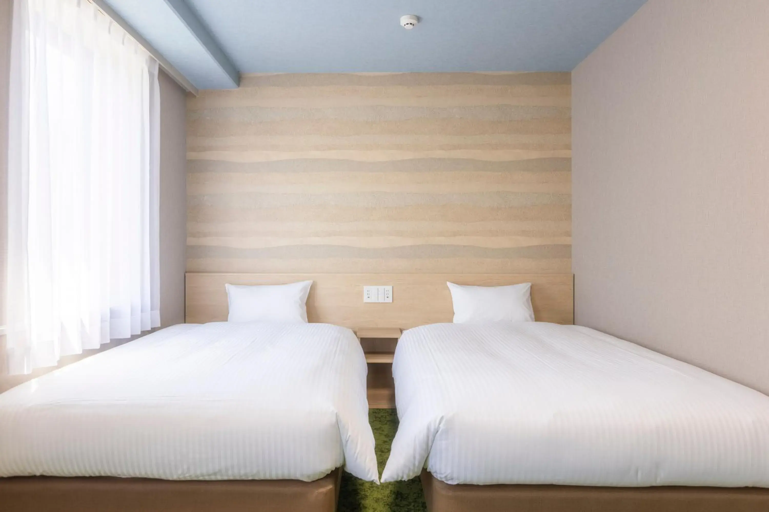 Bed in KOKO HOTEL Shizuoka - formerly Hotel Wing International Shizuoka Bed in KOKO HOTEL Shizuoka - formerly Hotel Wing International Shizuoka