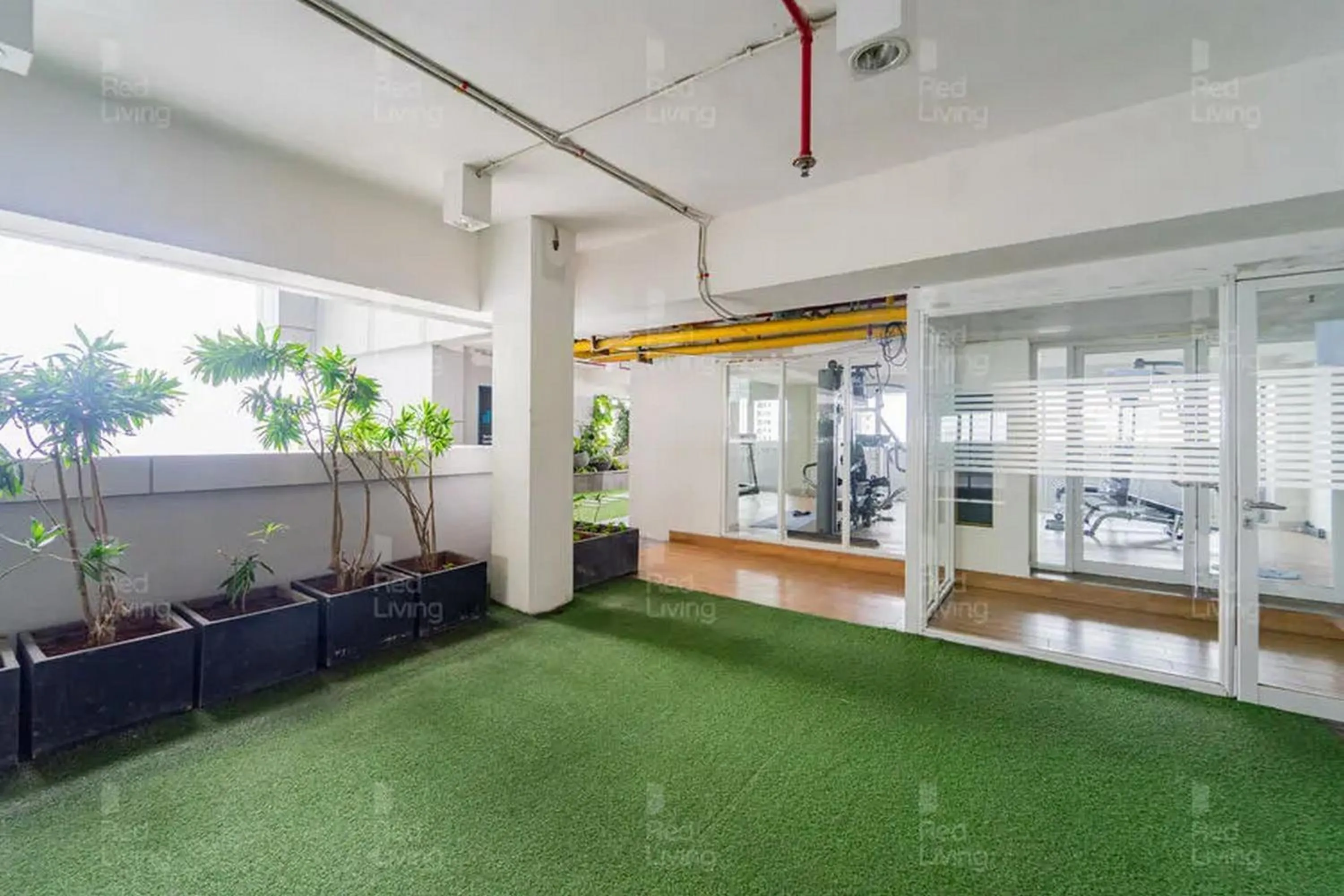 Garden in RedLiving Apartemen Grand Kamala Lagoon - Icha Rooms Tower Barclay South with Netflix