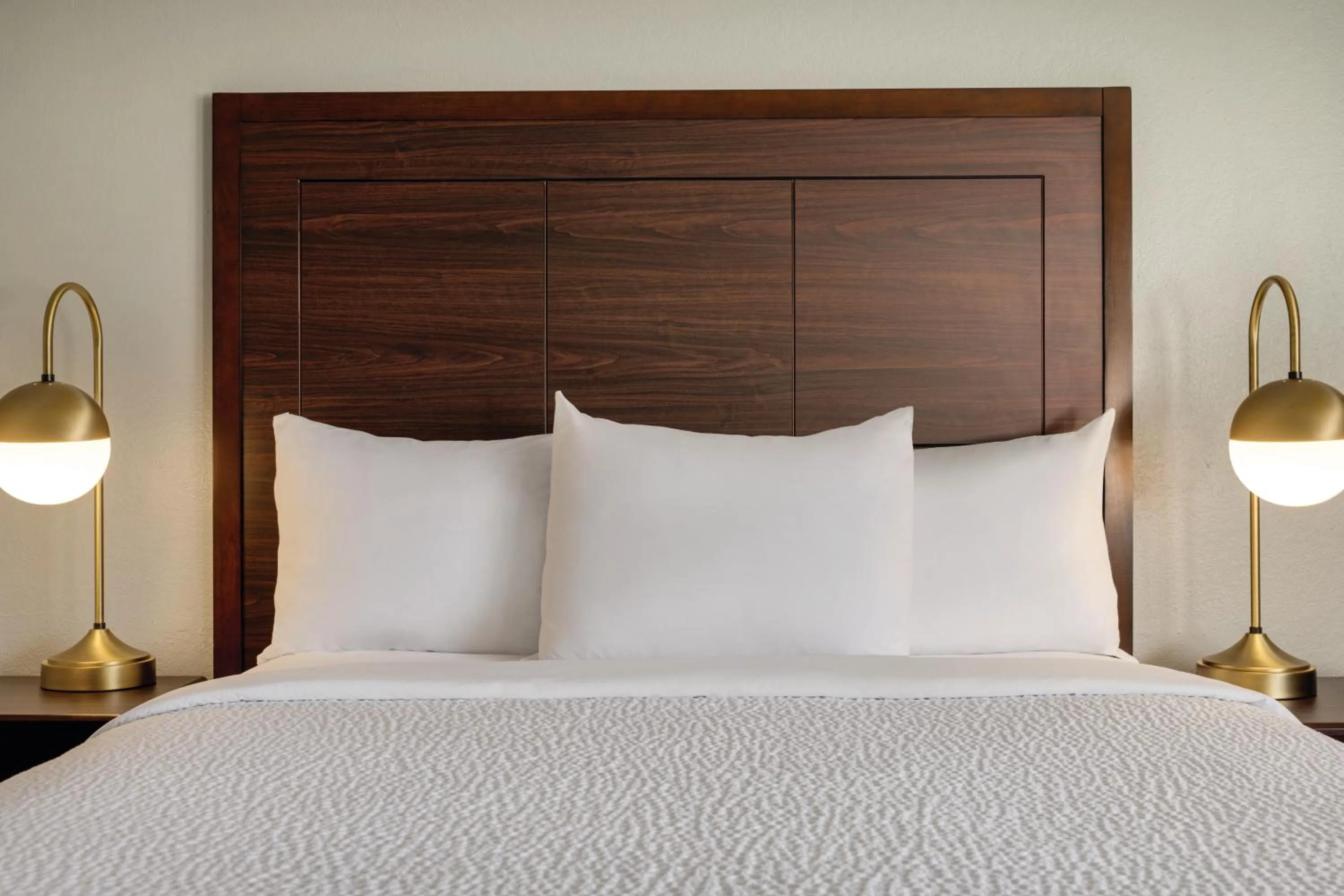 Bed in AmericInn by Wyndham Madison WI