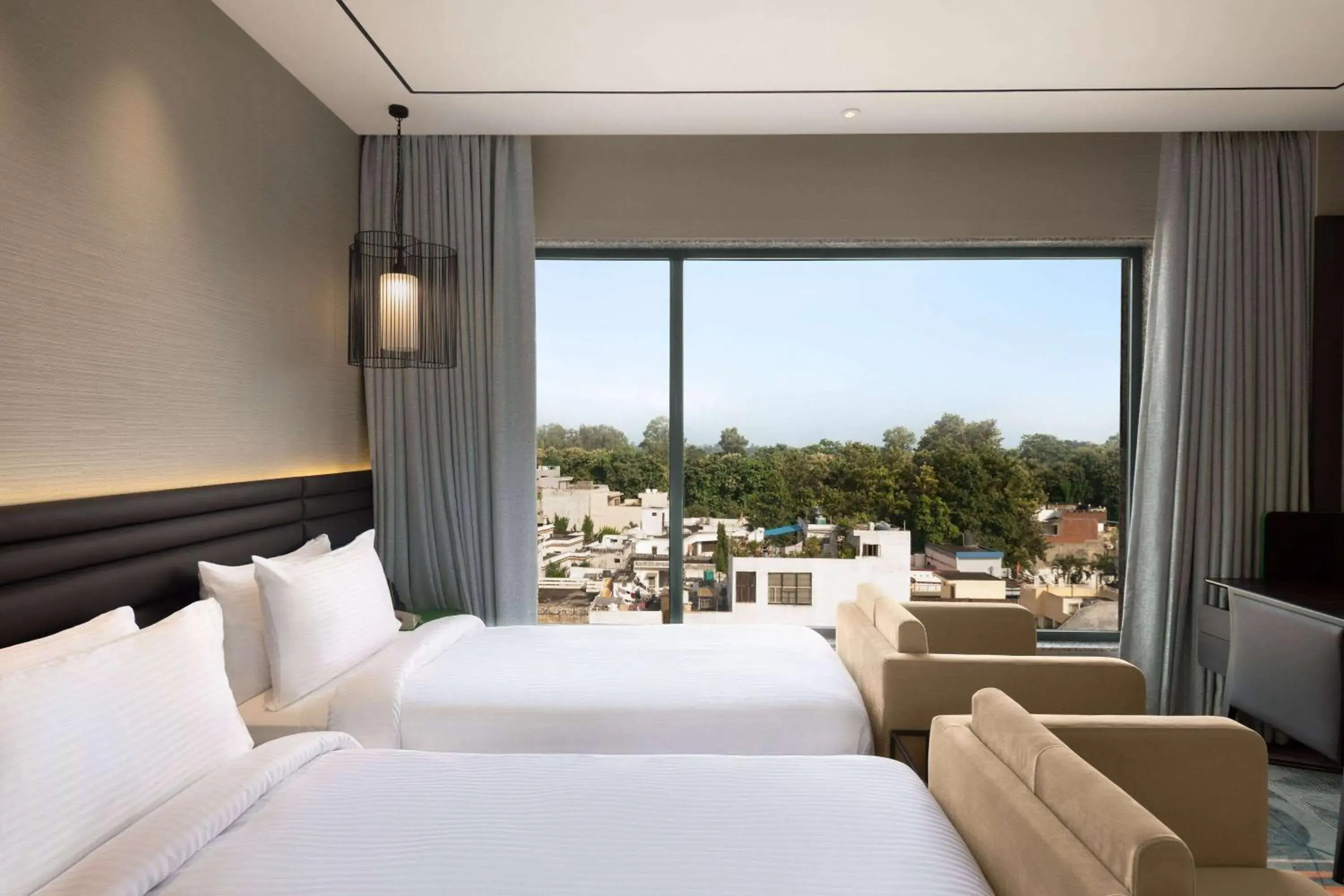 Photo of the whole room, Bed in Ramada Encore by Wyndham Bareilly Civil Lines Photo of the whole room, Bed in Ramada Encore by Wyndham Bareilly Civil Lines