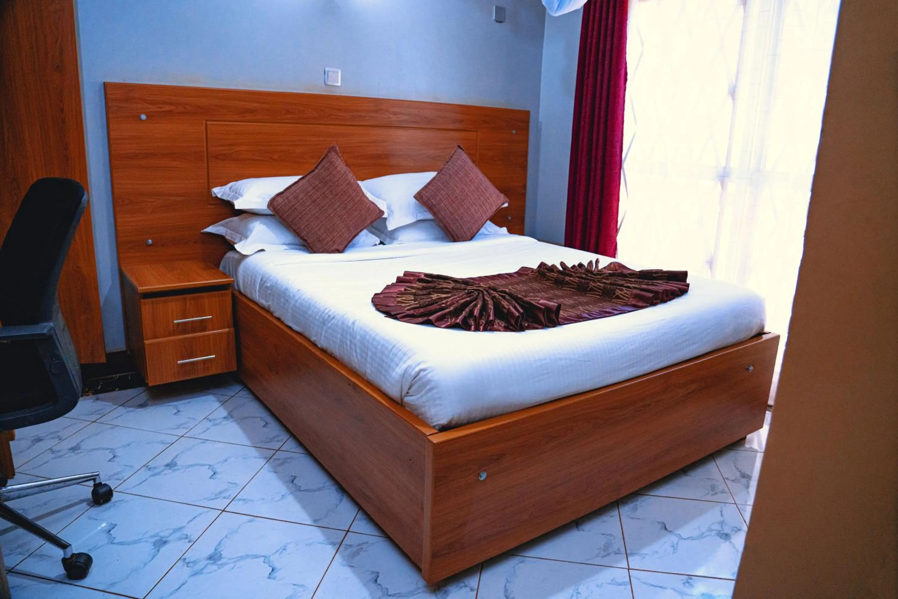 Bed in GOLDEN QUEST HOTEL