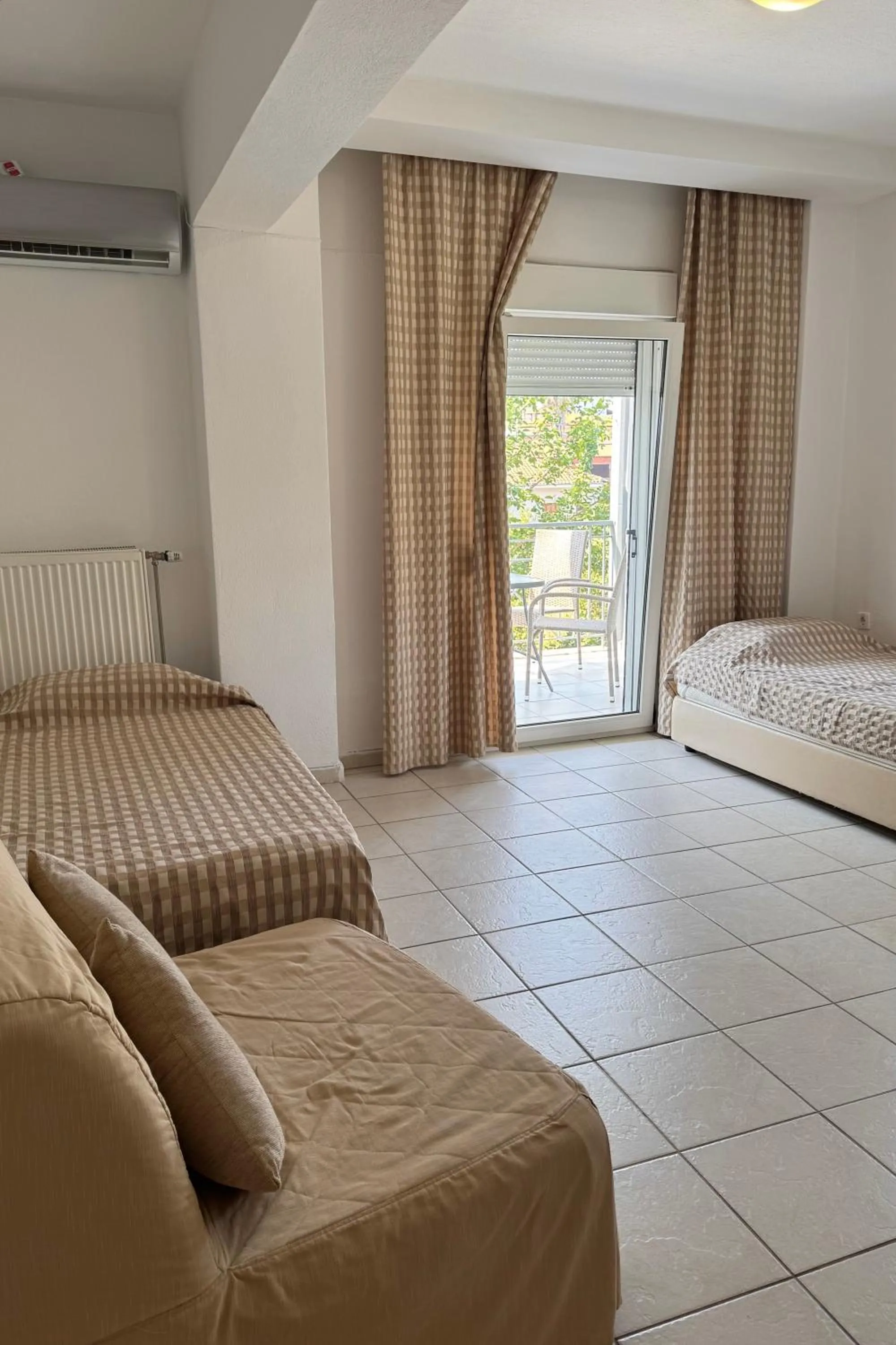 Bed in Milos Apartments