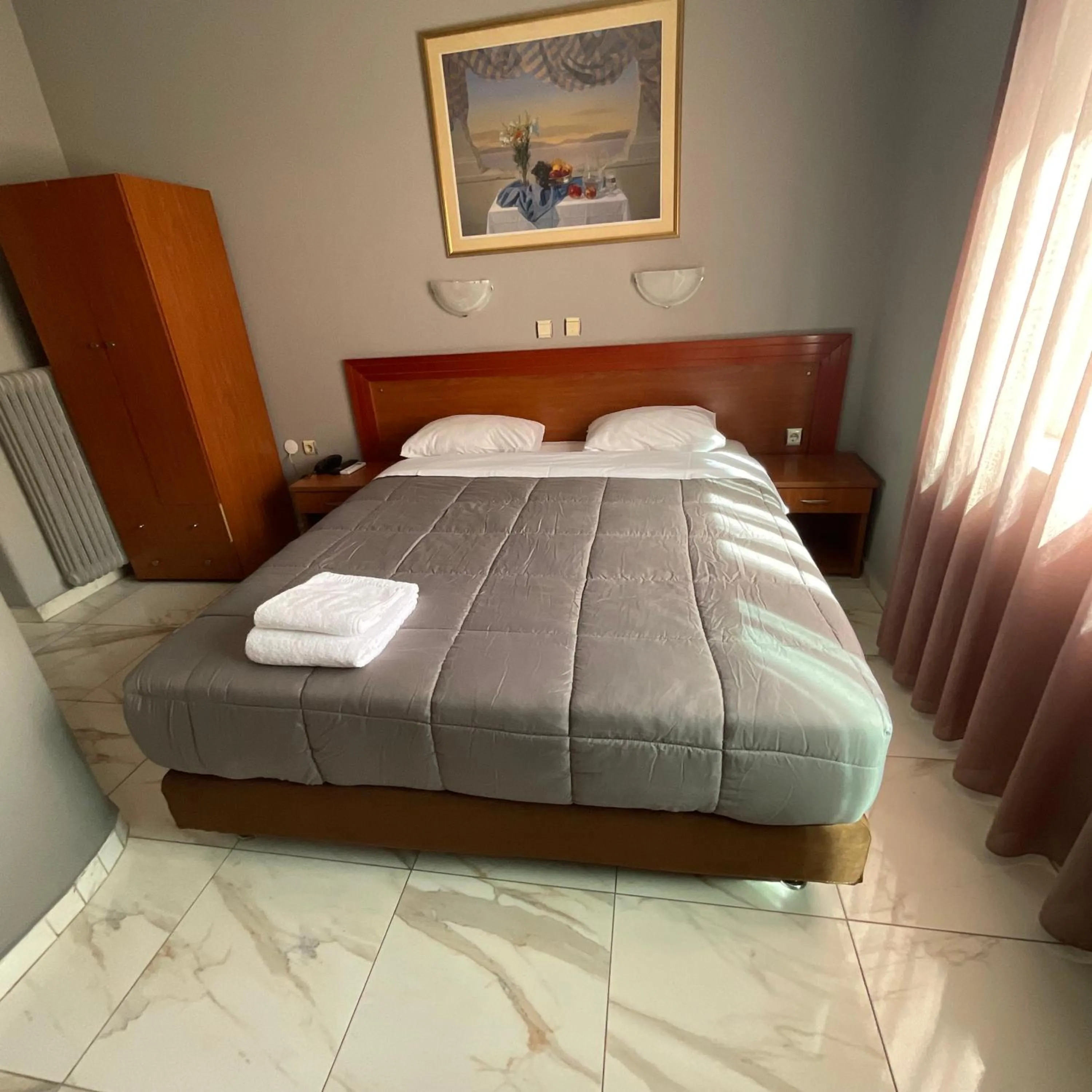 Bed in Piraeus Acropole Hotel