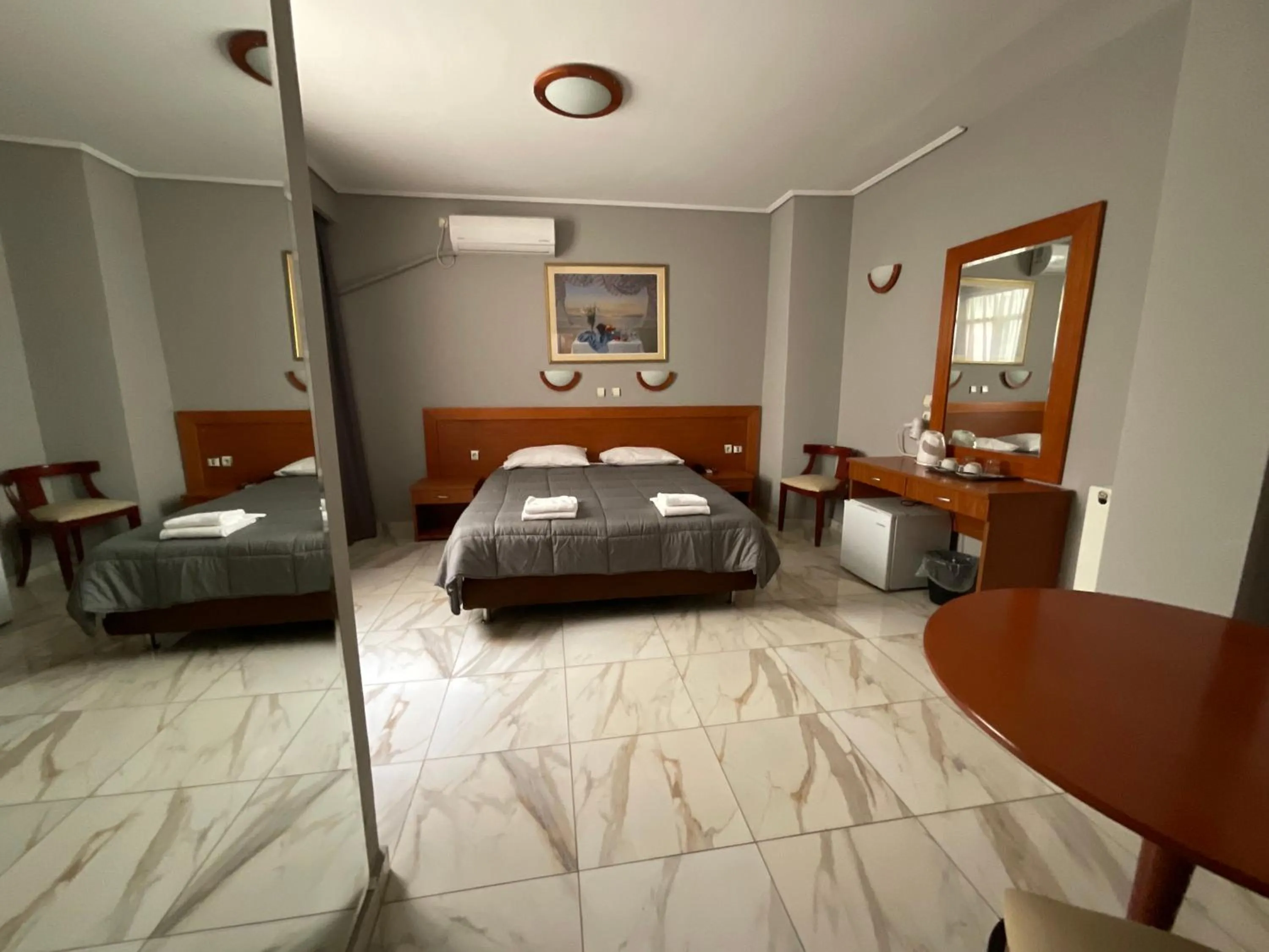 Bed in Piraeus Acropole Hotel