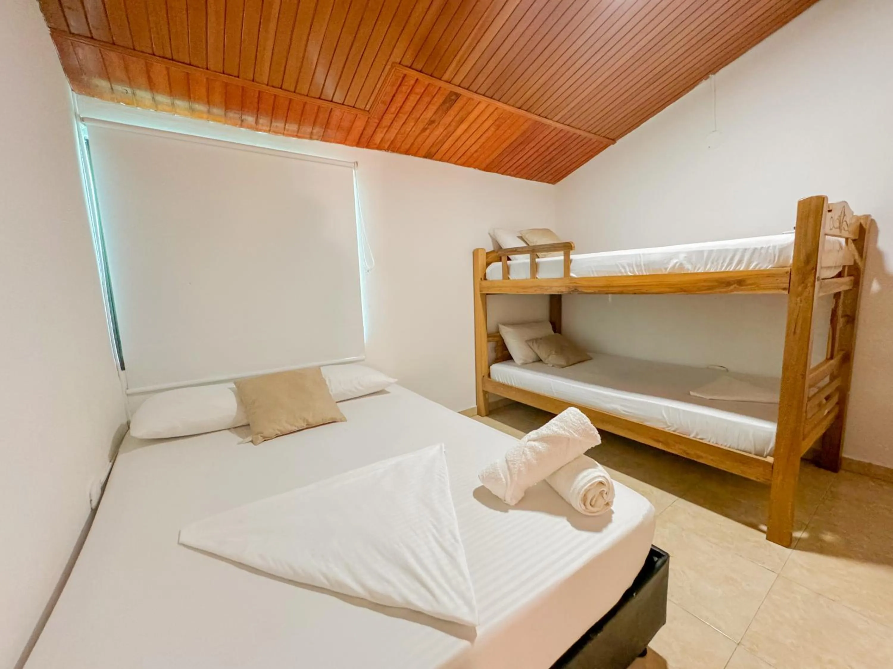 Bed in Hotel Tamaca House