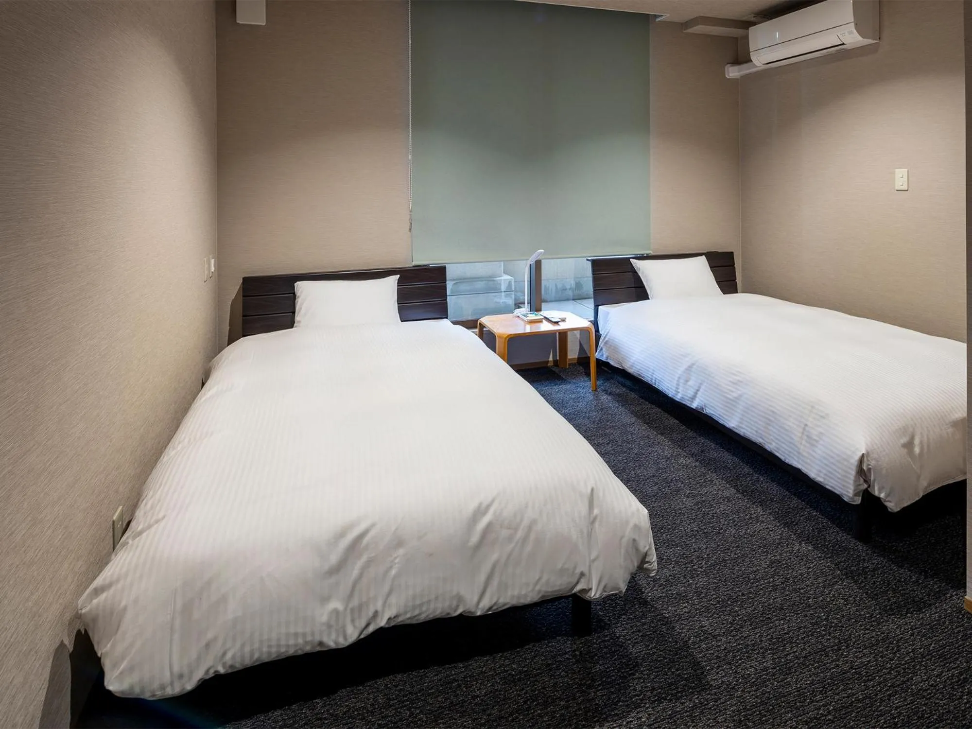 Bed in KANEMITSU CAPITAL HOTEL