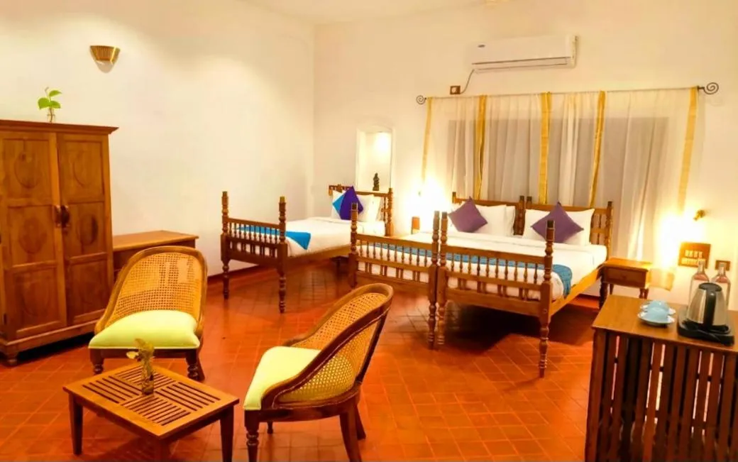 Bed in Marari Beach Bungalow Resort Alleppey