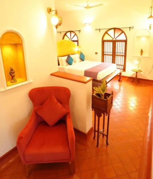 Bed in Marari Beach Bungalow Resort Alleppey