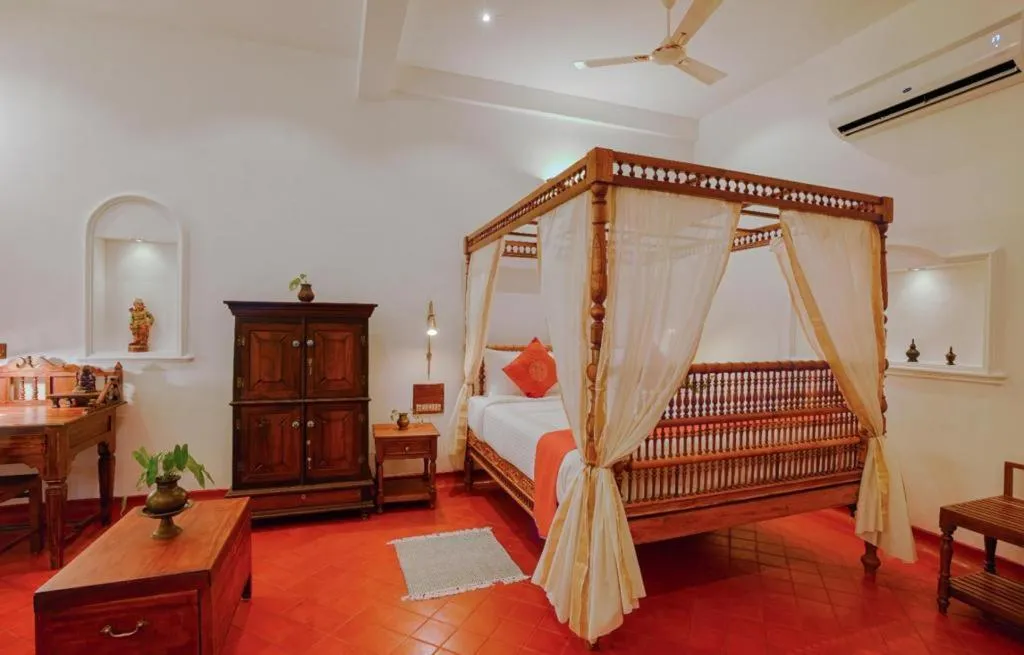 Bed in Marari Beach Bungalow Resort Alleppey
