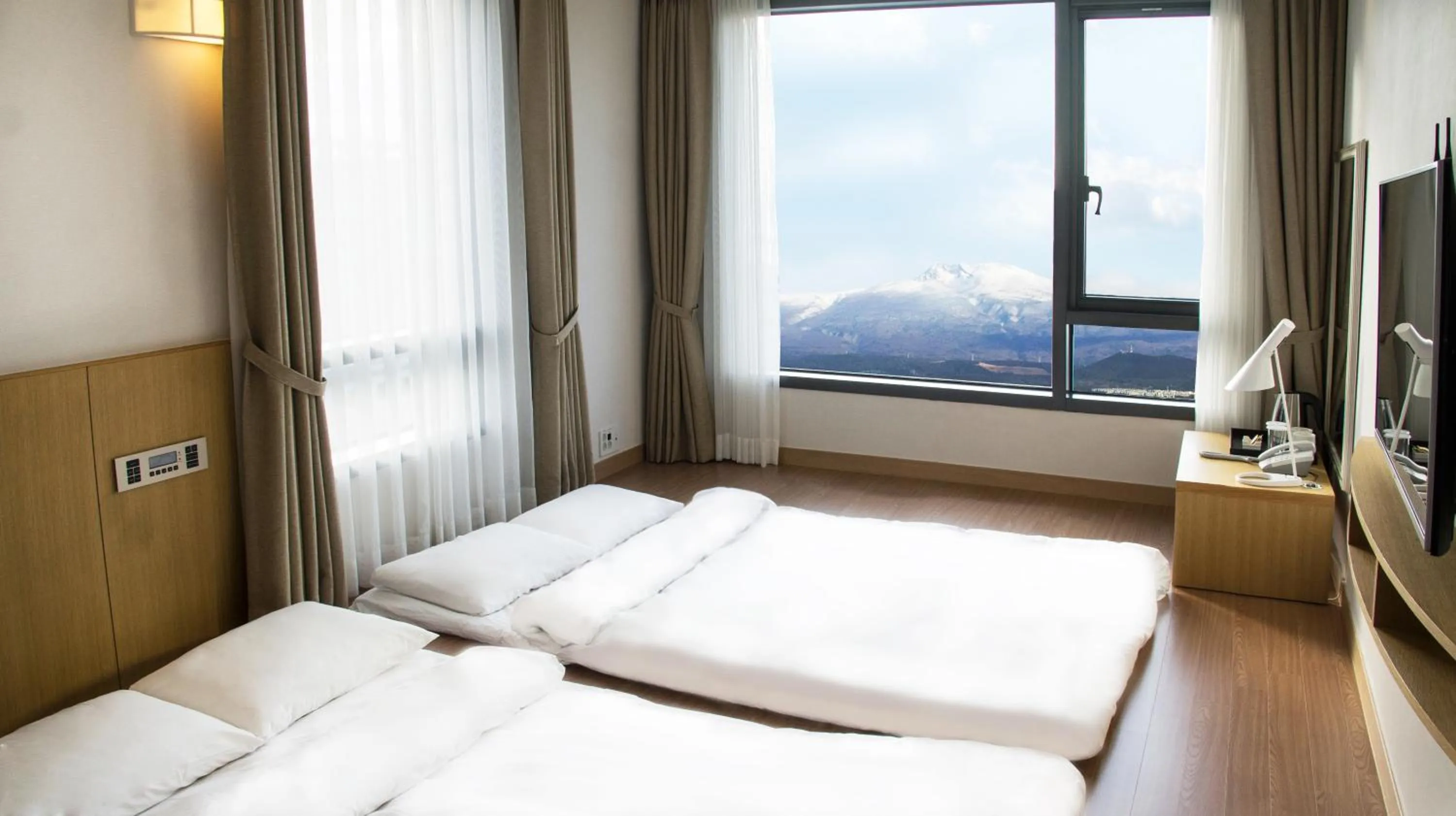 Bed in Jeju Hotel the M