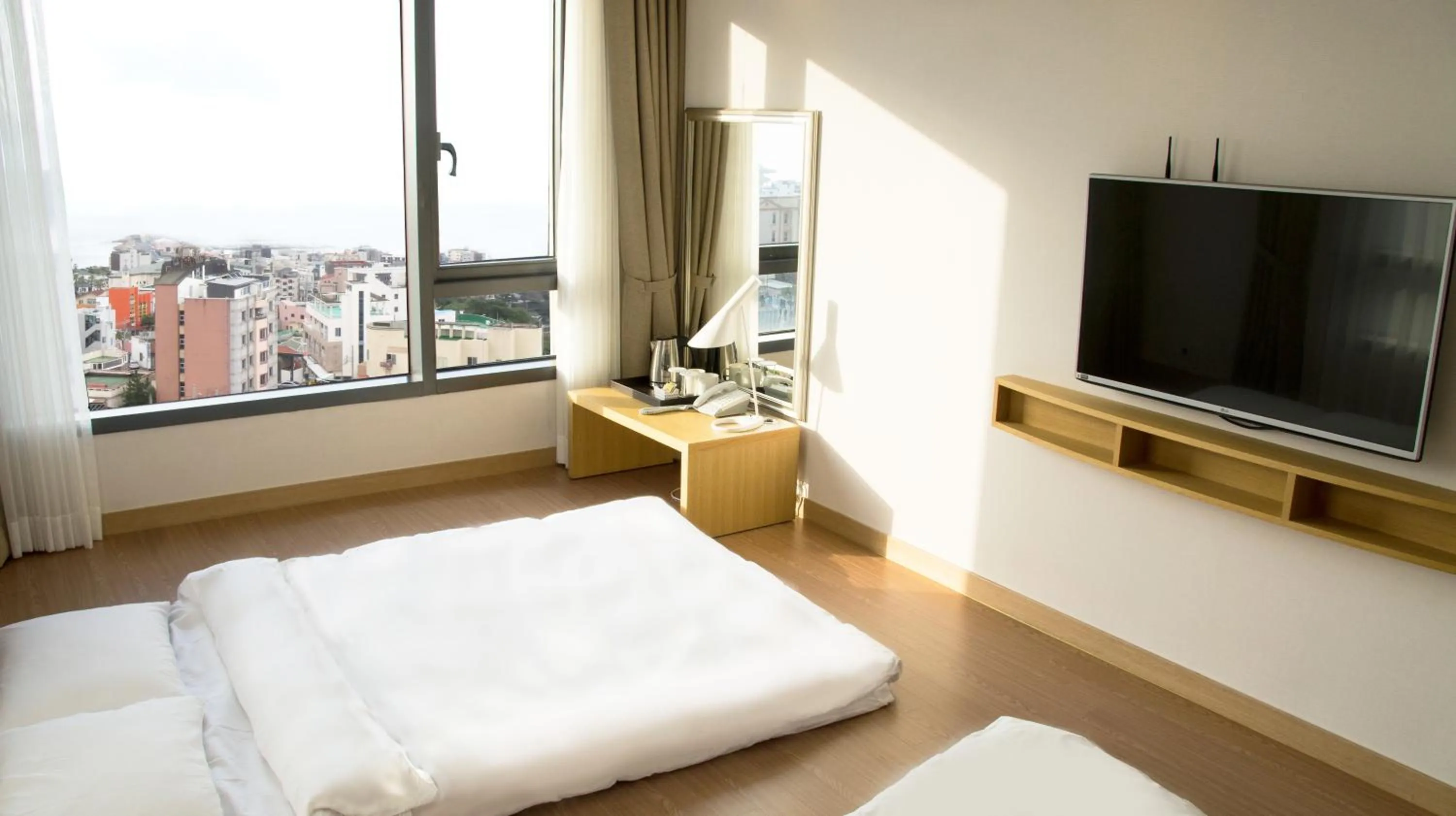 Bed in Jeju Hotel the M