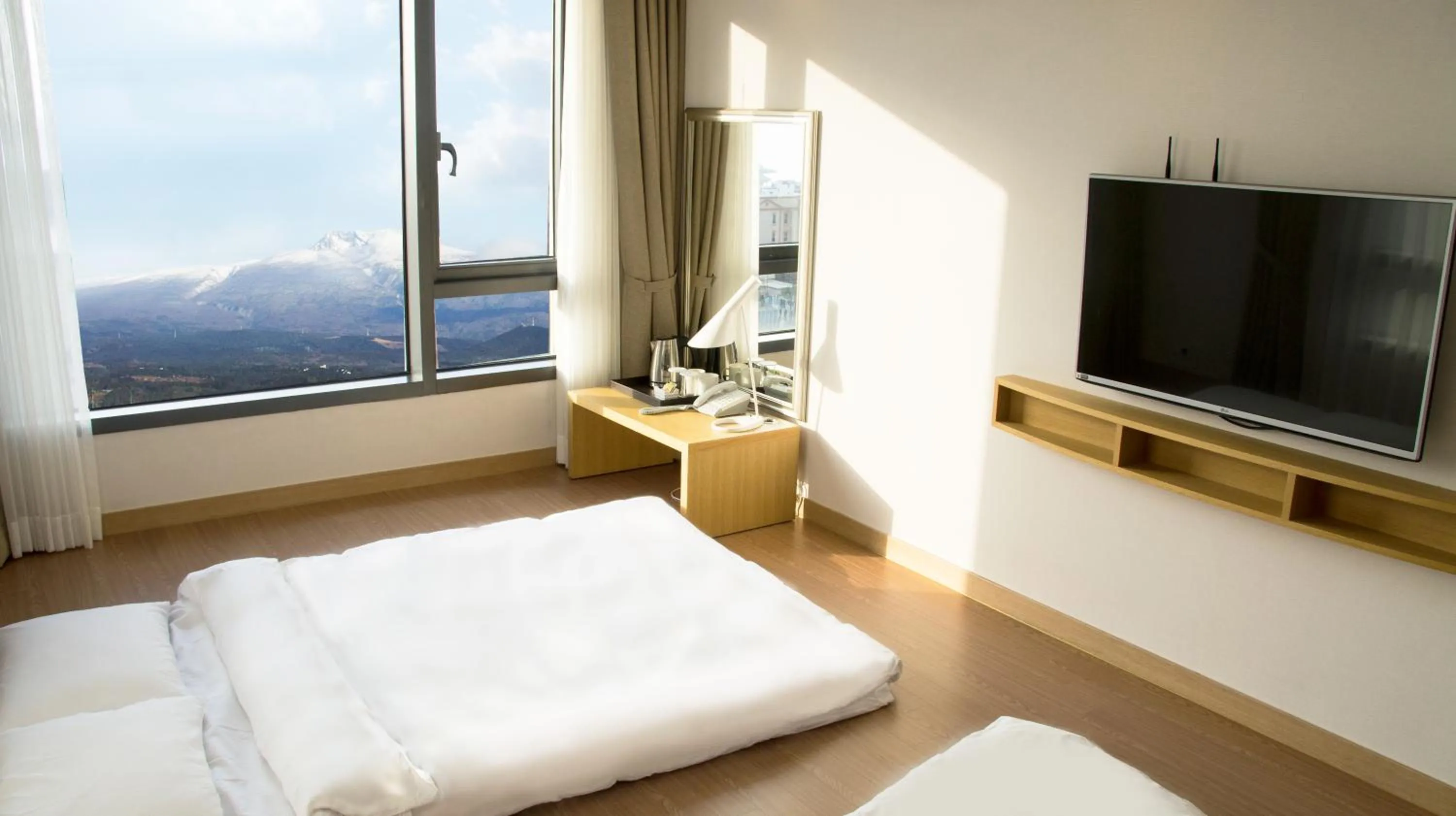 Bed in Jeju Hotel the M