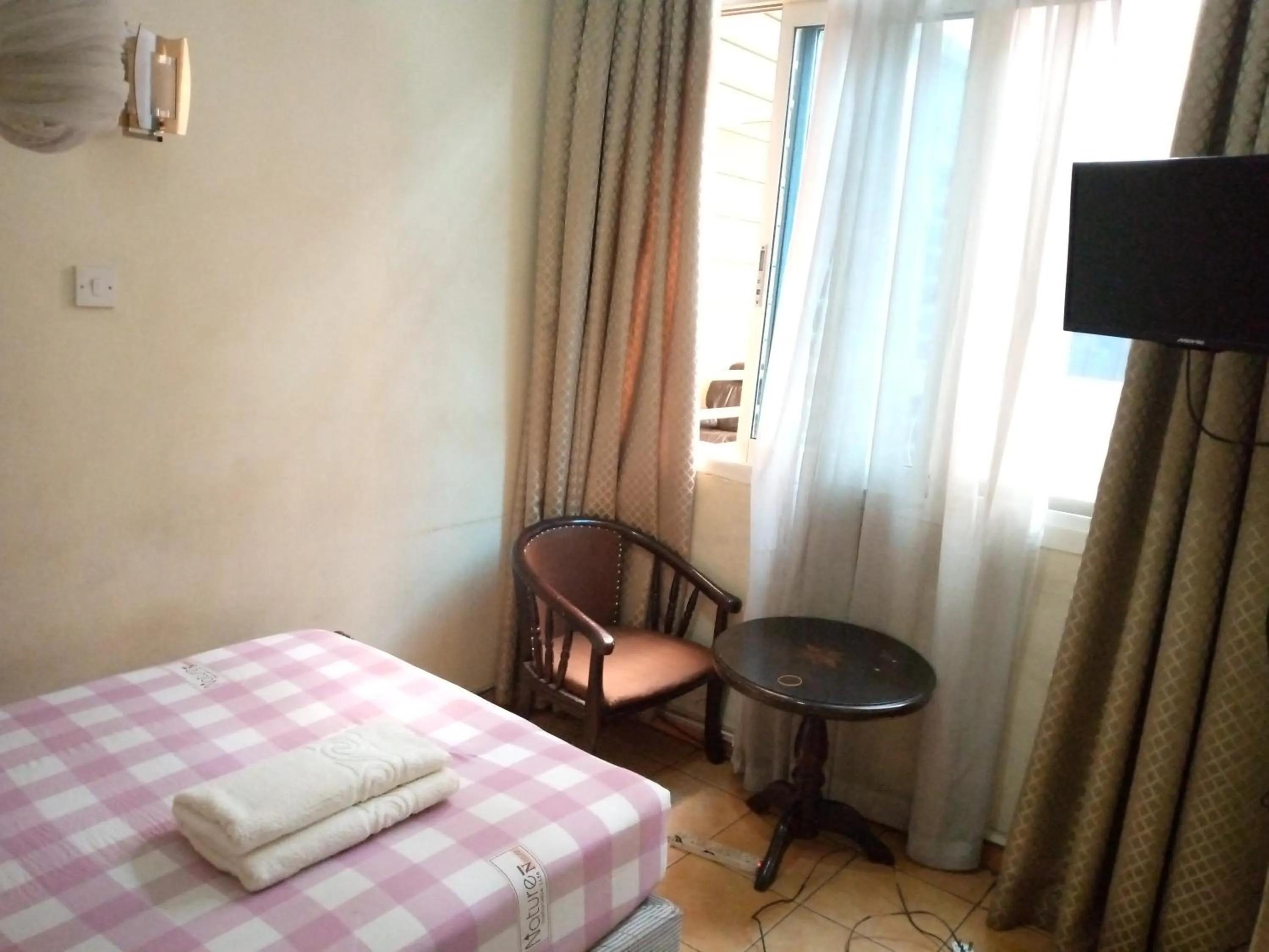 Bed in DOUBLE FIVE HOTEL