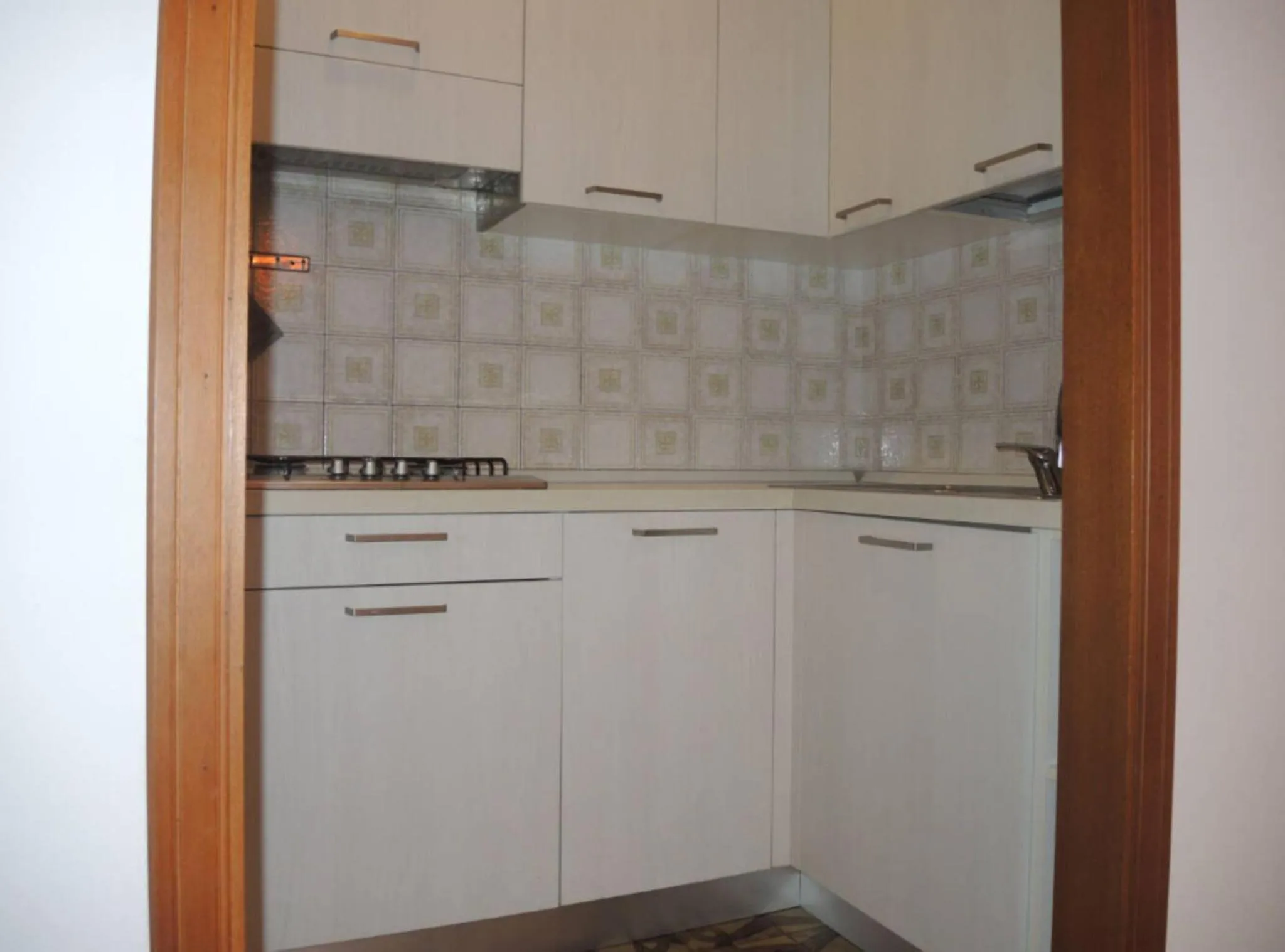kitchen in Family apartment steps from Pluto Beach