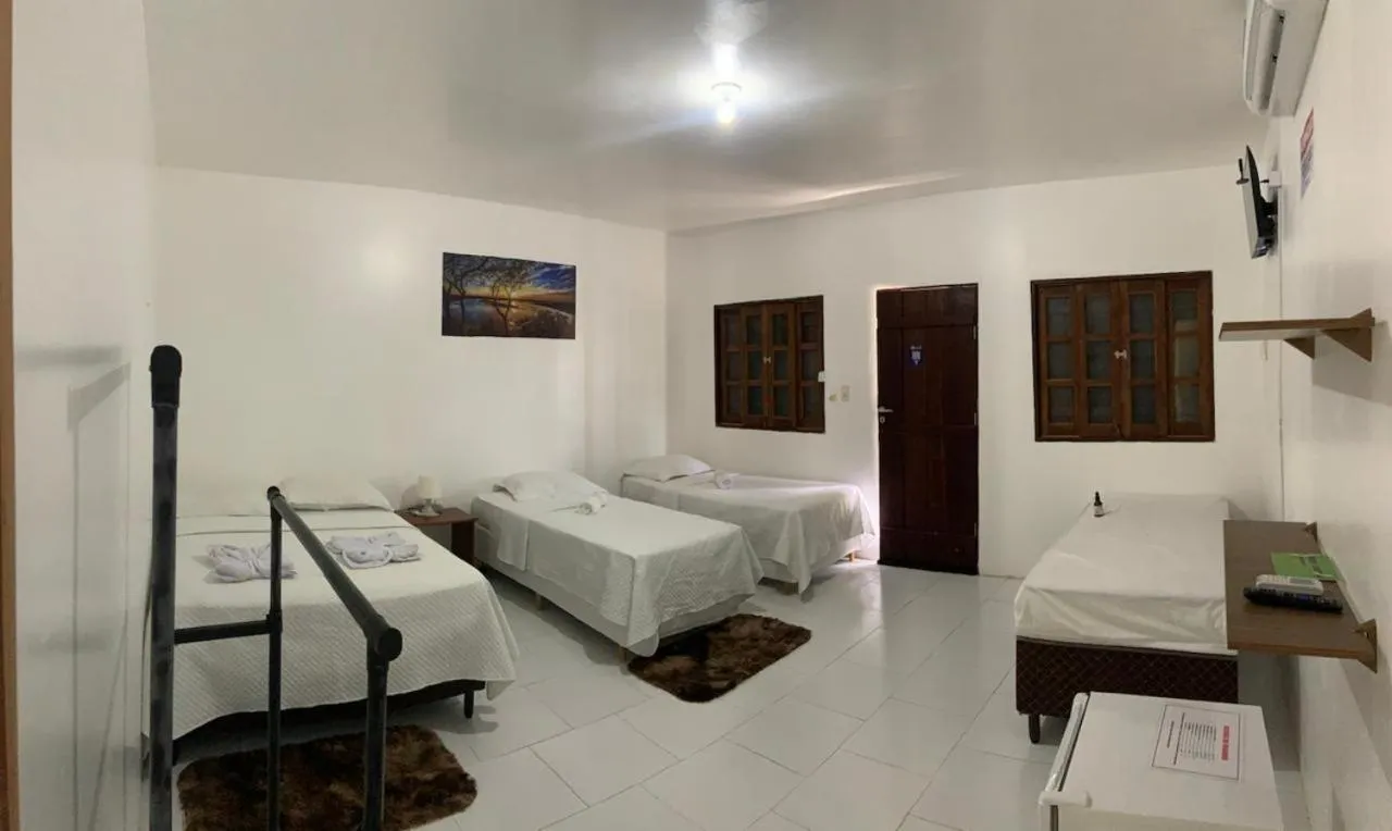 Bed in POUSADA ESTRELA DA MANHÃ