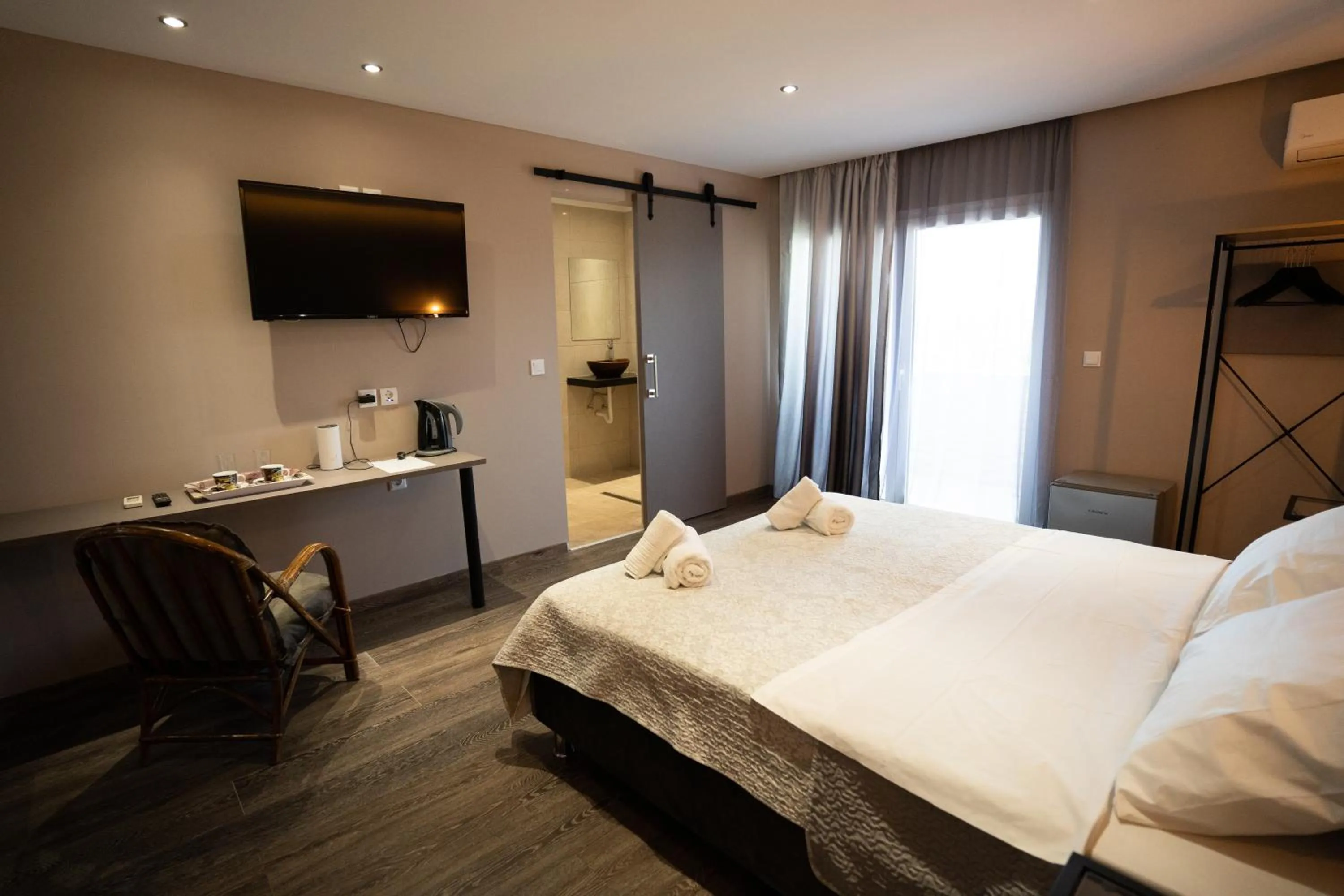 Bed in Parthenis Riviera Hotel