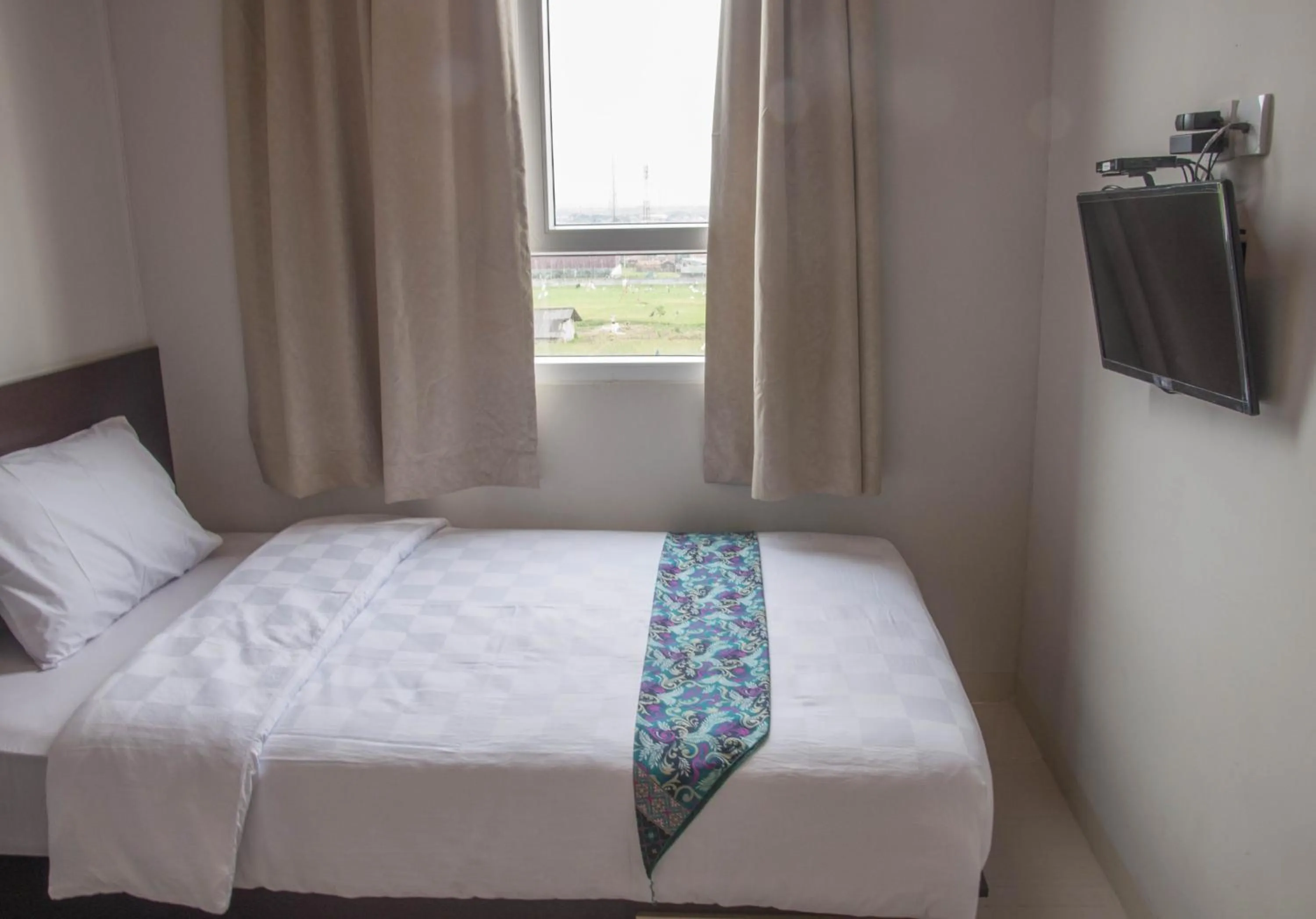 Bed in Skyland City Hotel Jatinangor