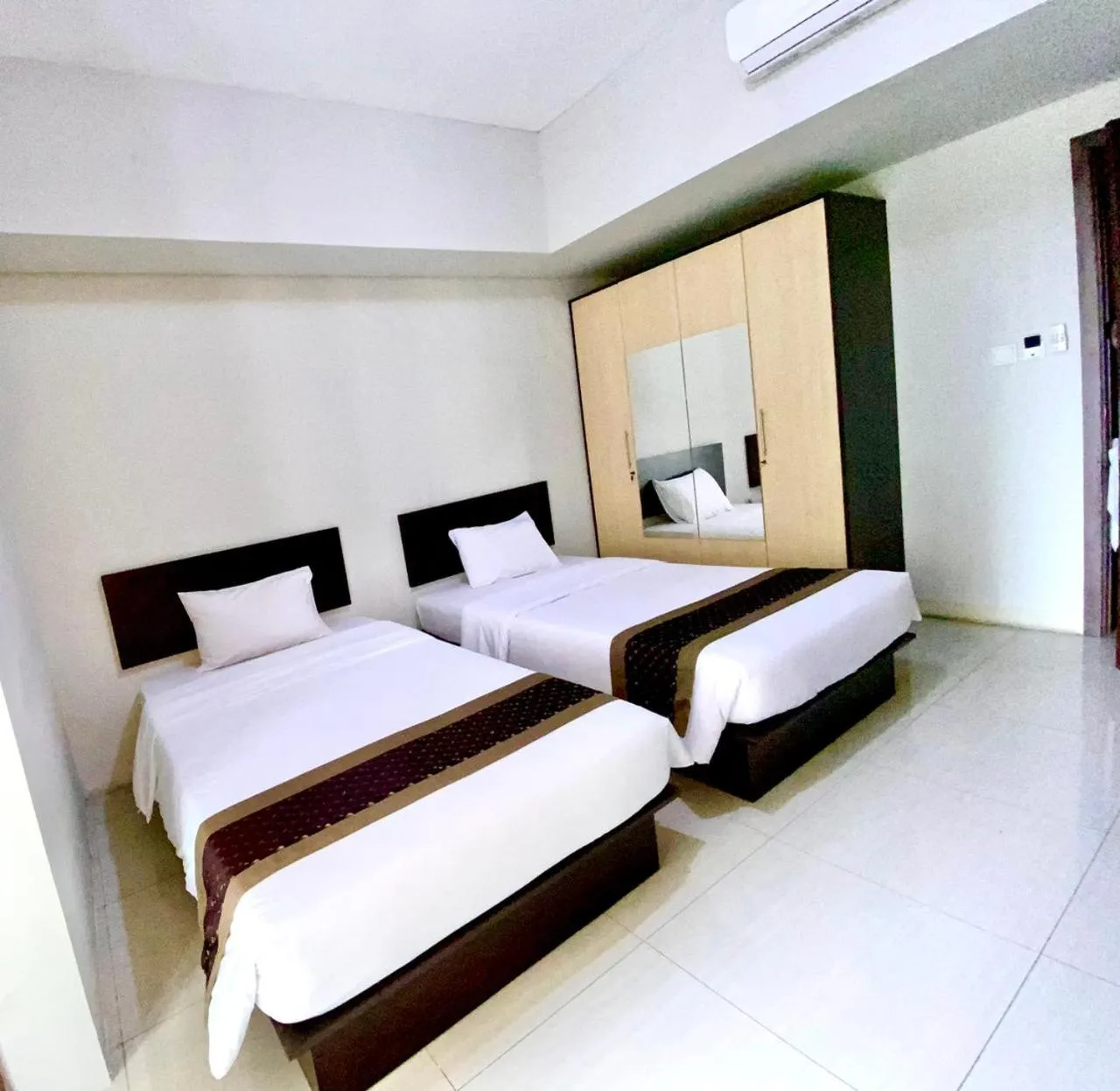 Bed in Skyland City Hotel Jatinangor