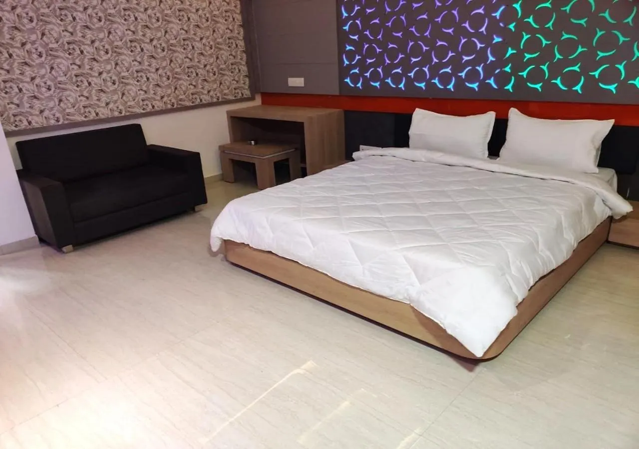 Bed in The Grand Takshak Hotel