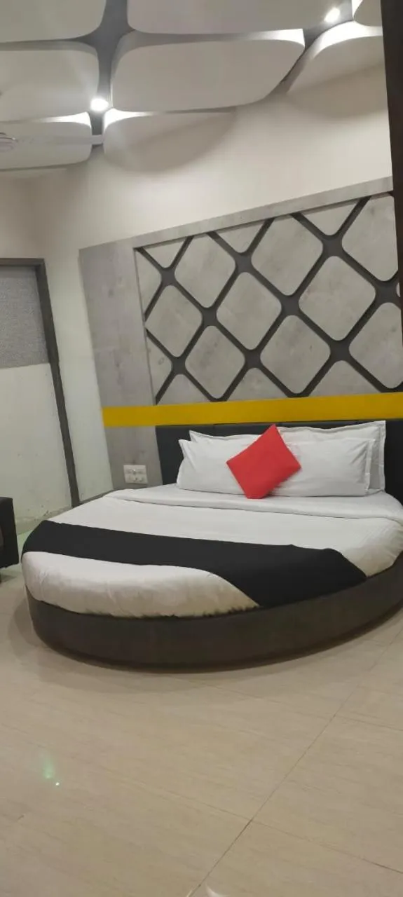 Bed in The Grand Takshak Hotel