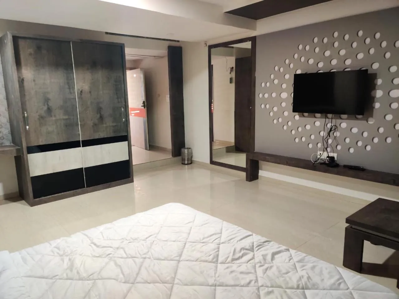 Bed in The Grand Takshak Hotel