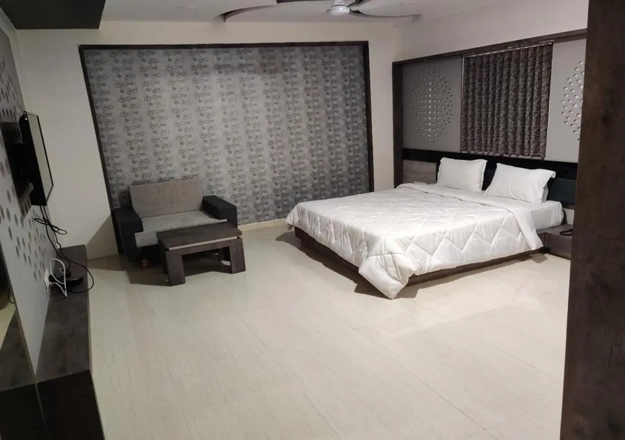 Bed in The Grand Takshak Hotel