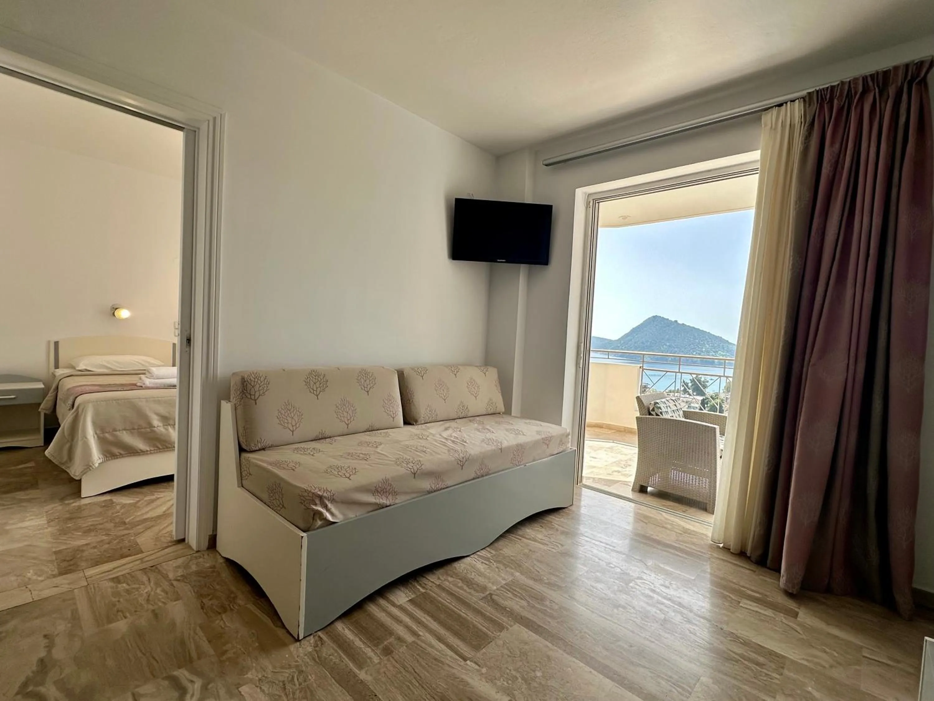 Bed in Hotel Apartments Panorama