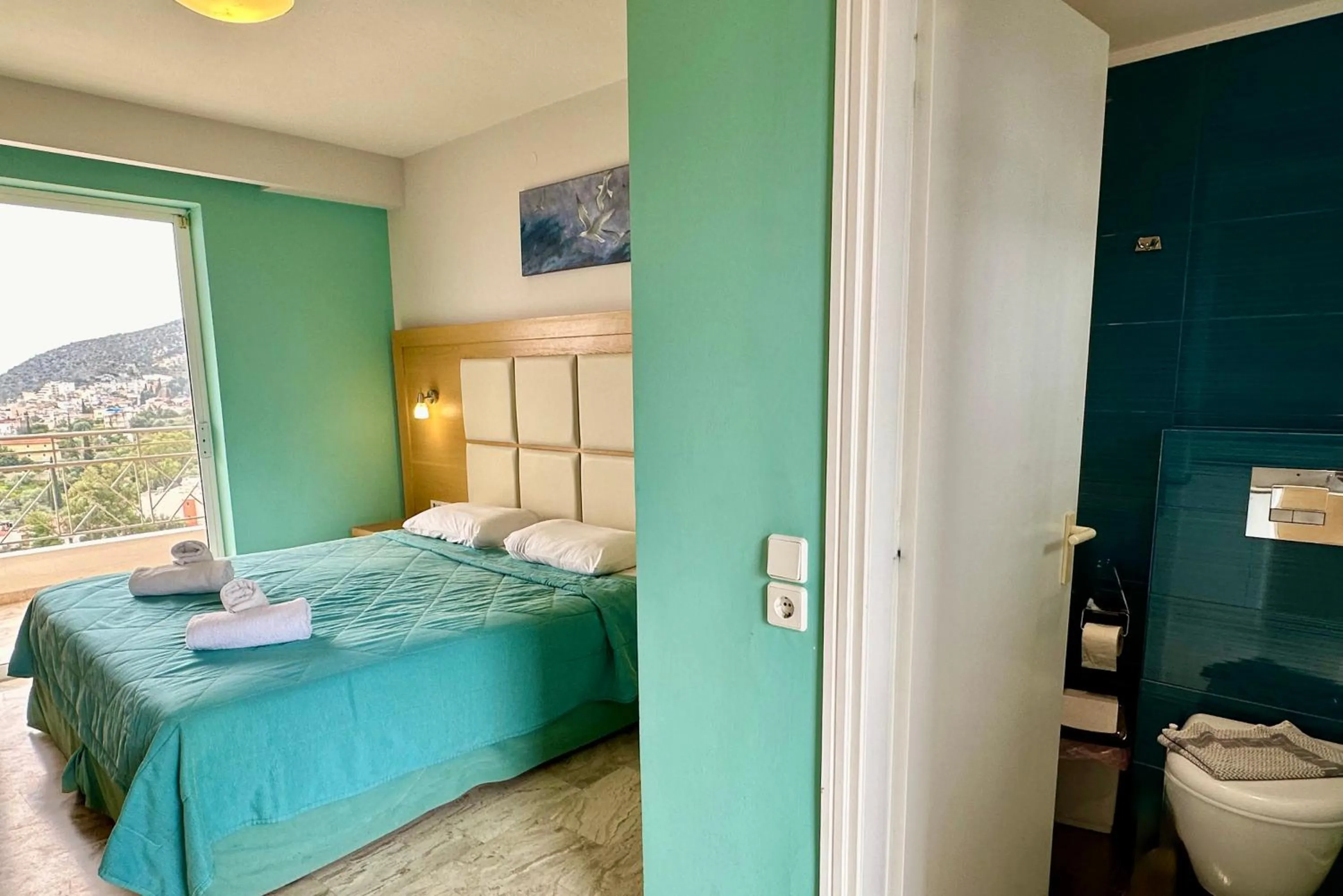 Bed in Hotel Apartments Panorama