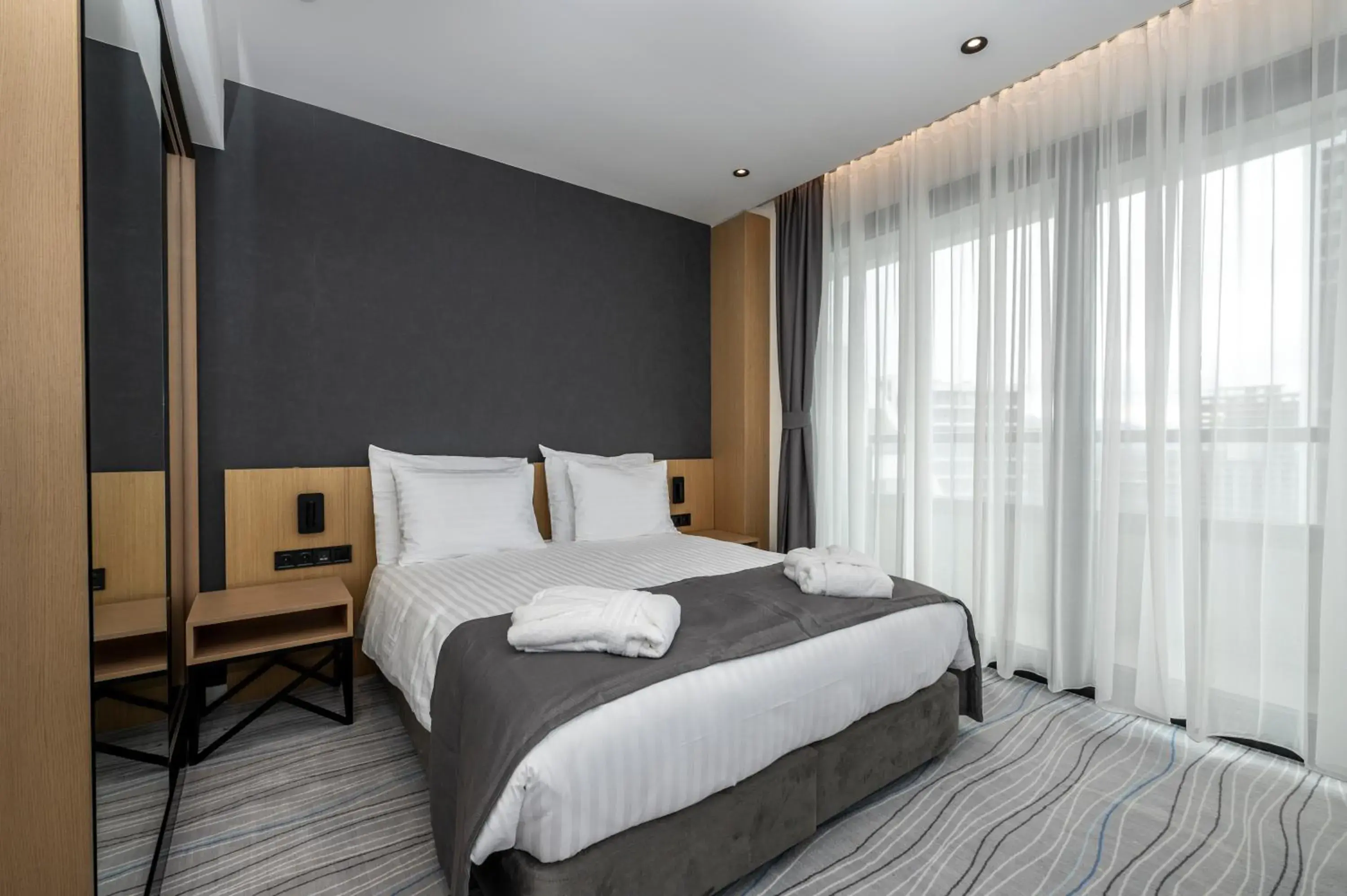 Bed in The Grandeur Hotel Bed in The Grandeur Hotel