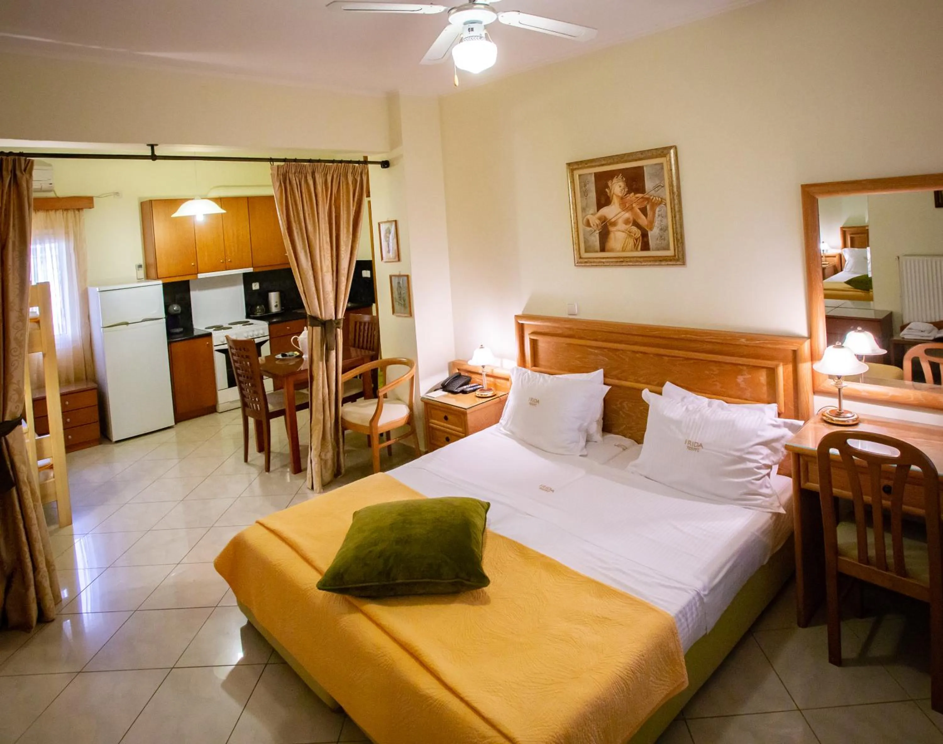 Bed in Irida Beach Resort Suites