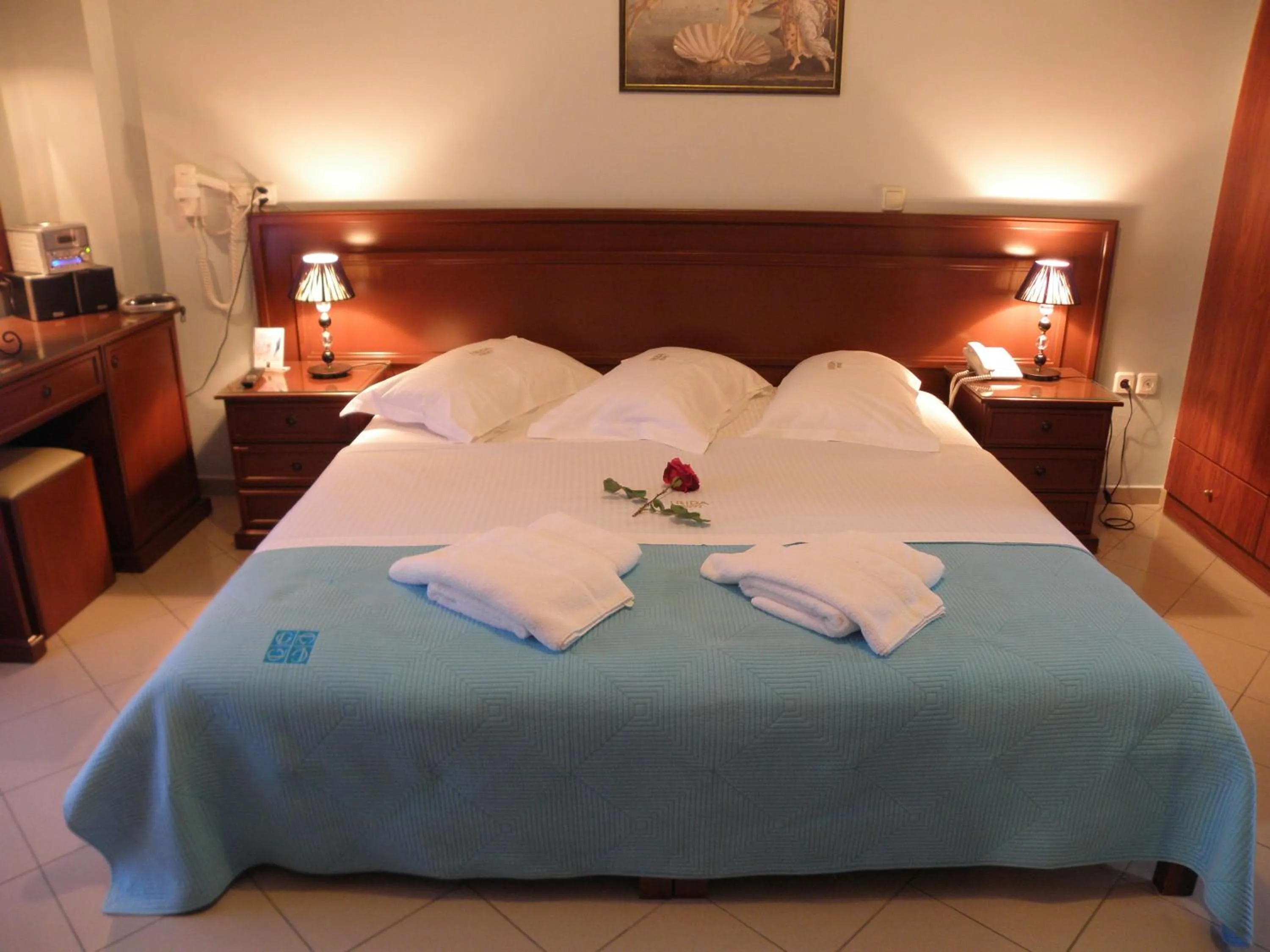 Bed in Irida Beach Resort Suites