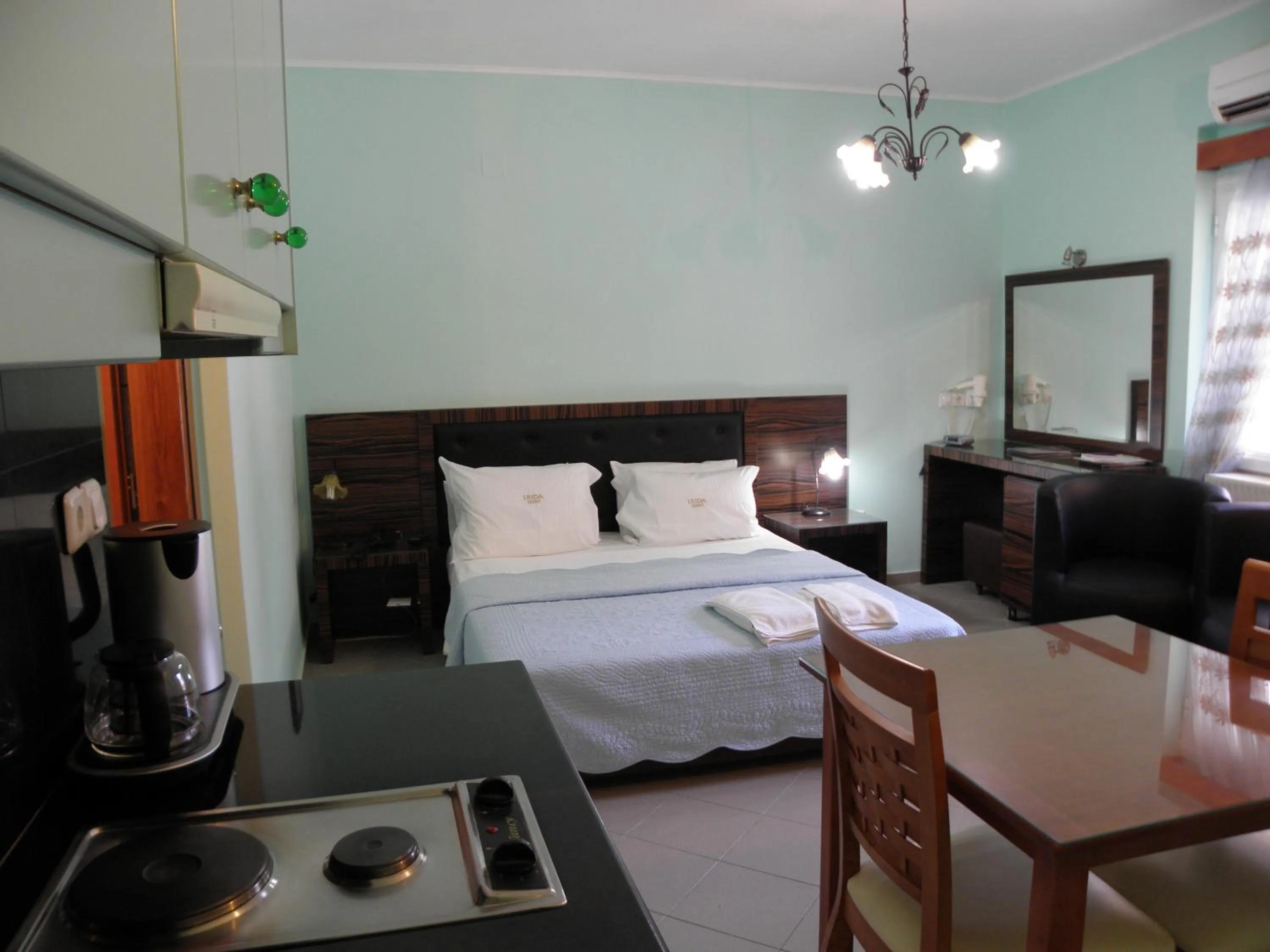 Bed in Irida Beach Resort Suites