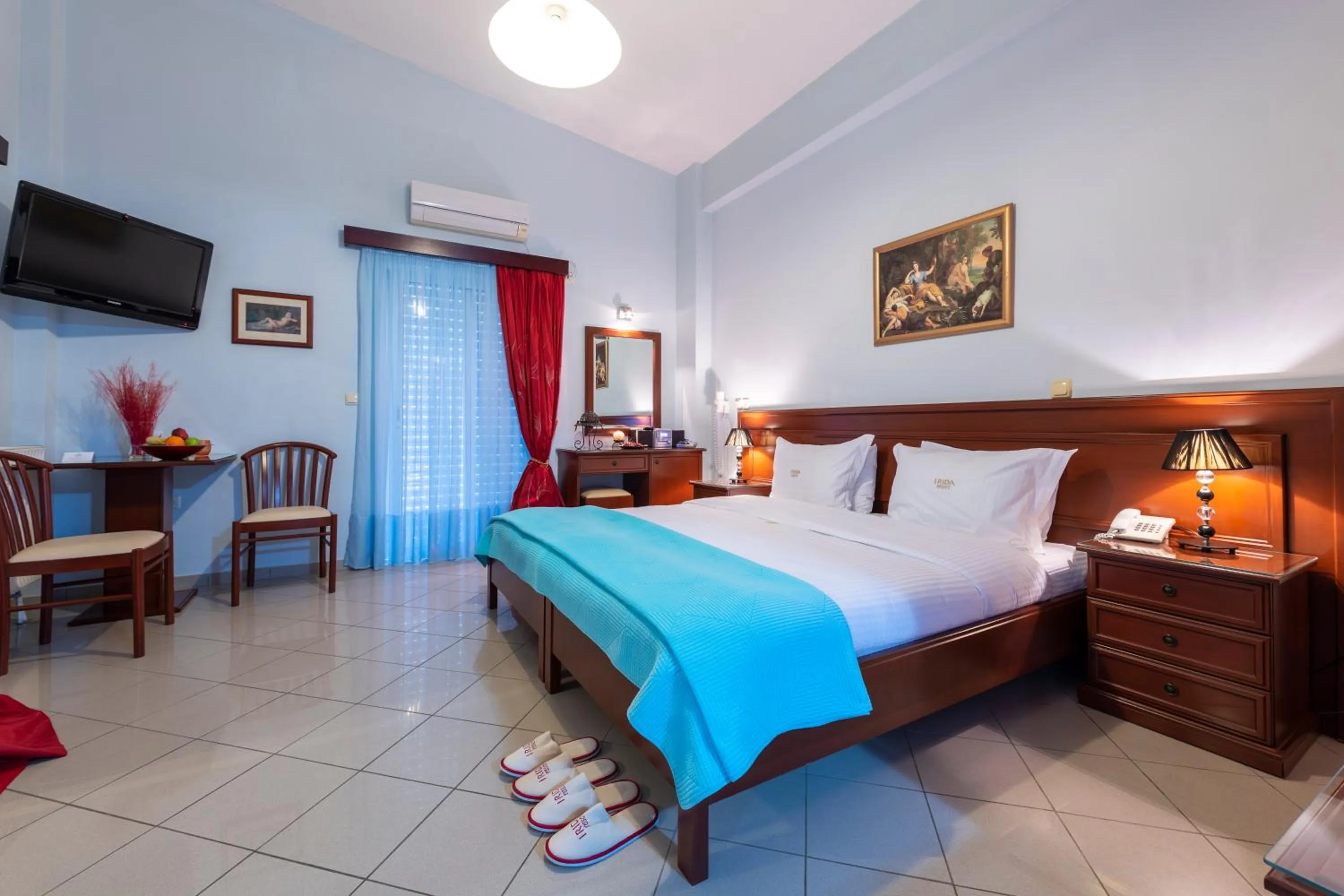 Bed in Irida Beach Resort Suites