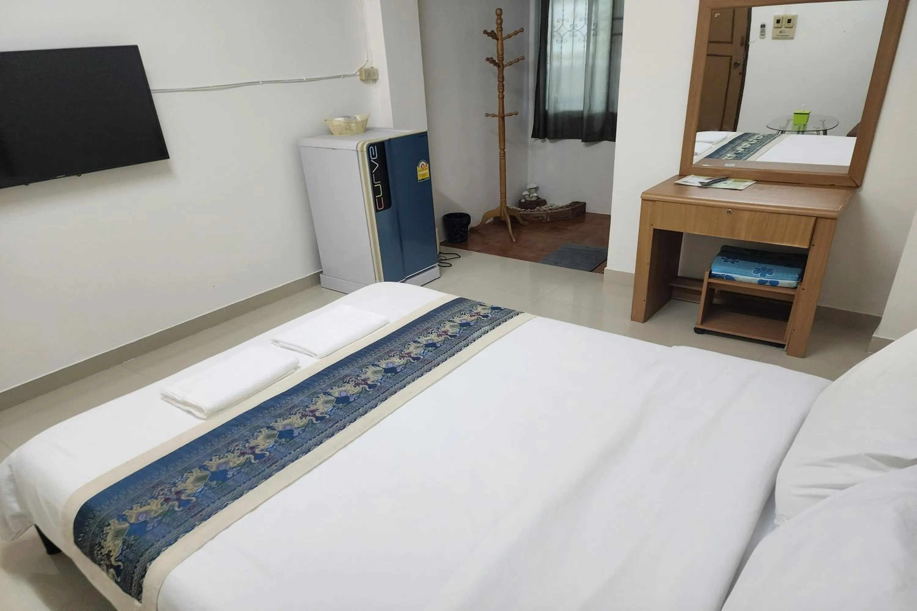 Bed in Green Apartment Kaset